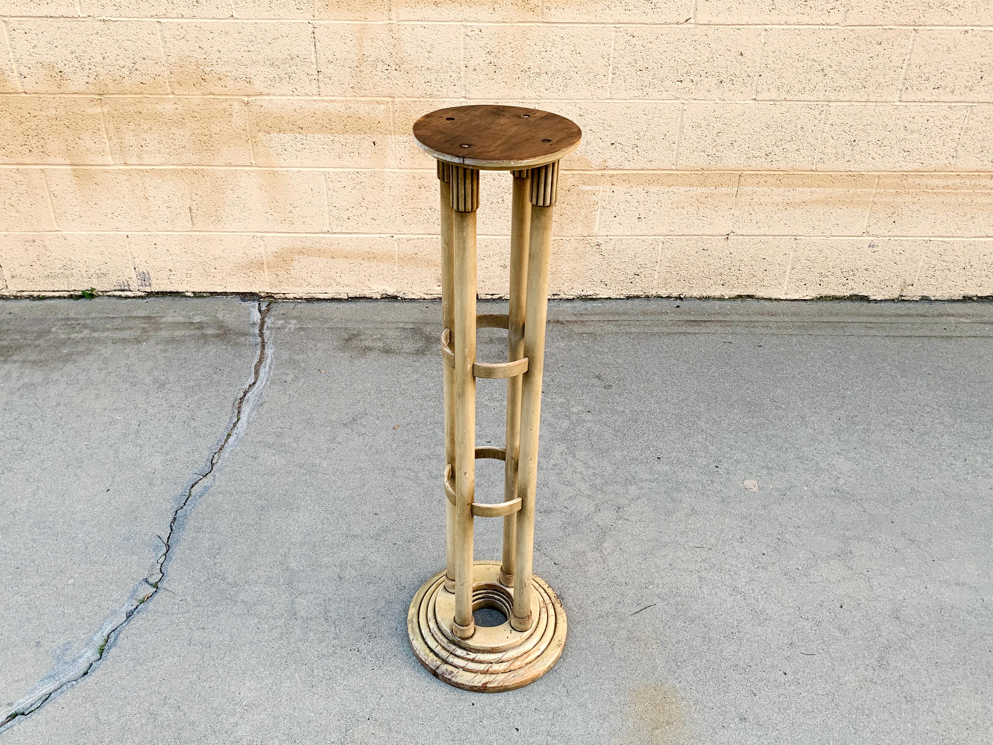 Vintage plant stand in the form of a neoclassical column. Art Deco/ Hollywood Regency styling. Original distressed finish with lacquer top coat. Structurally sound.

Dimensions: 38
