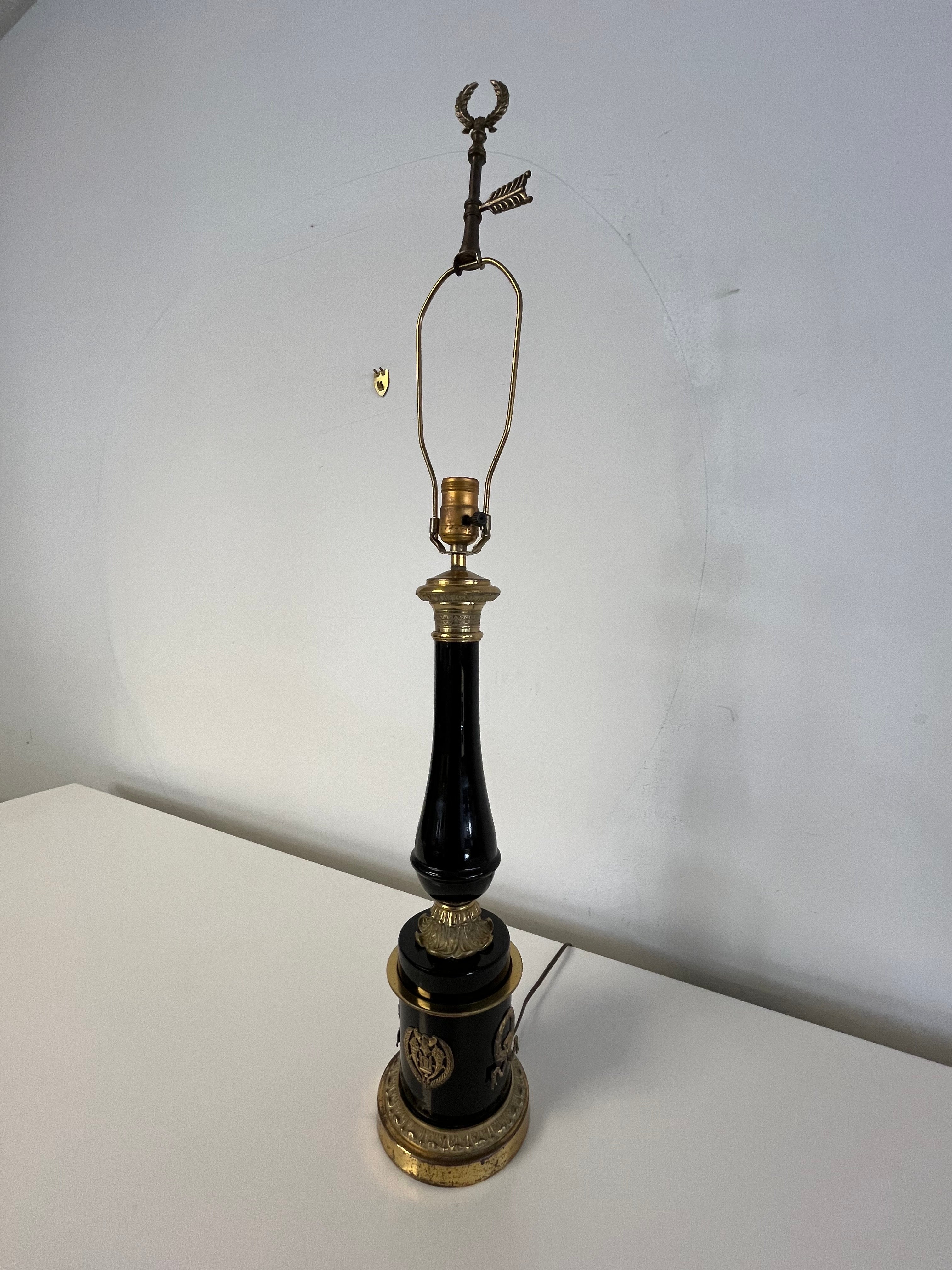 Beautiful neoclassical lamp in Black porcelain and brass ormolu laurel mounts. Classic design set atop a brass base. 