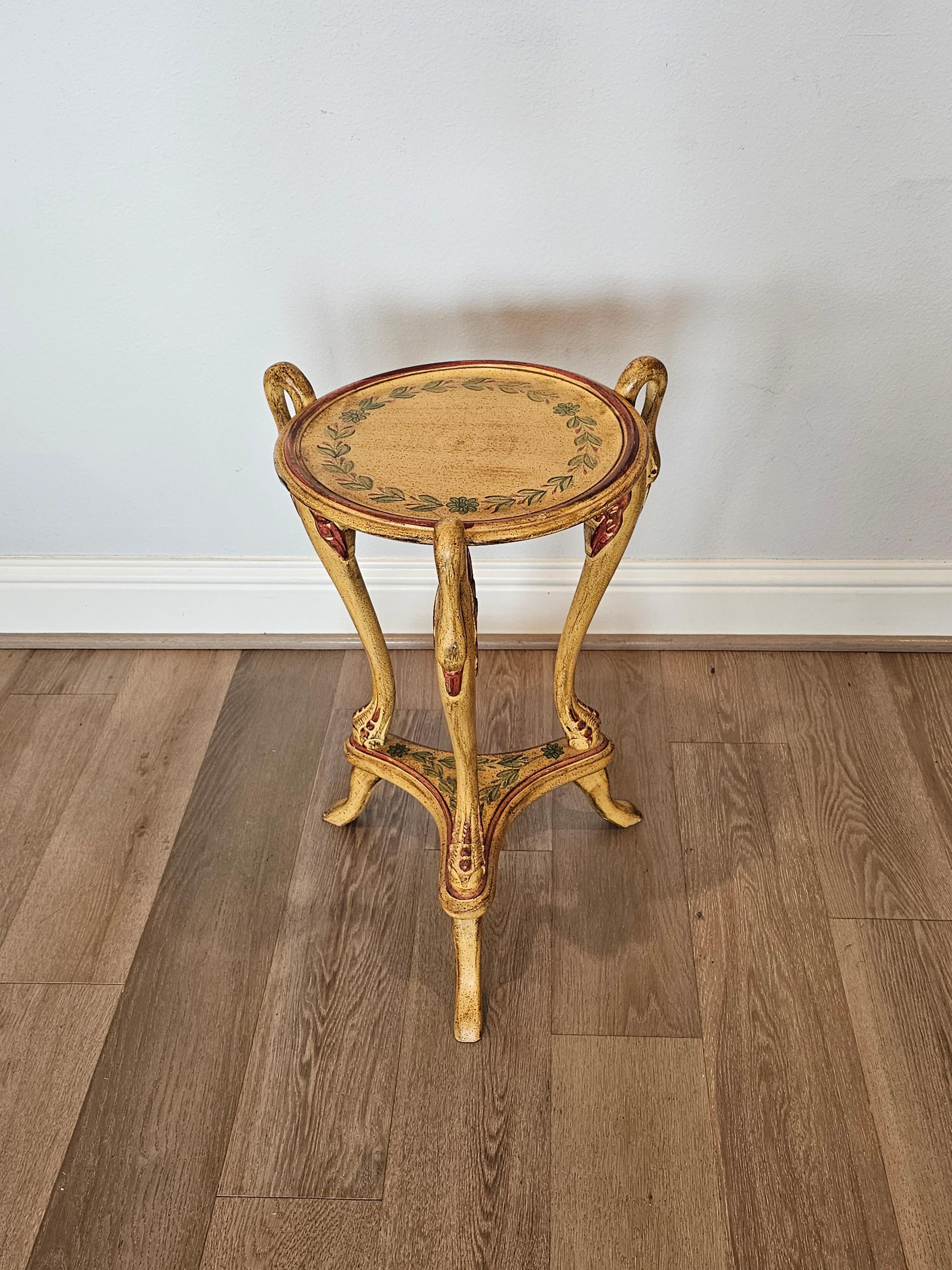 A vintage Italian Neoclassical style carved polychrome painted guéridon side table.

Born in the first half of the 20th century, elegant sculptural silhouette, Napoleonic Empire influence, having a circular top, rising on figural swan-form cabriole