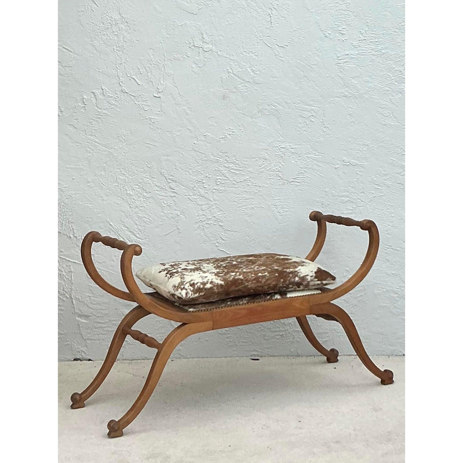 Introduce a touch of timeless elegance to your interior with this exquisite vintage Neoclassical scroll bench. Drawing inspiration from the ancient Roman 
