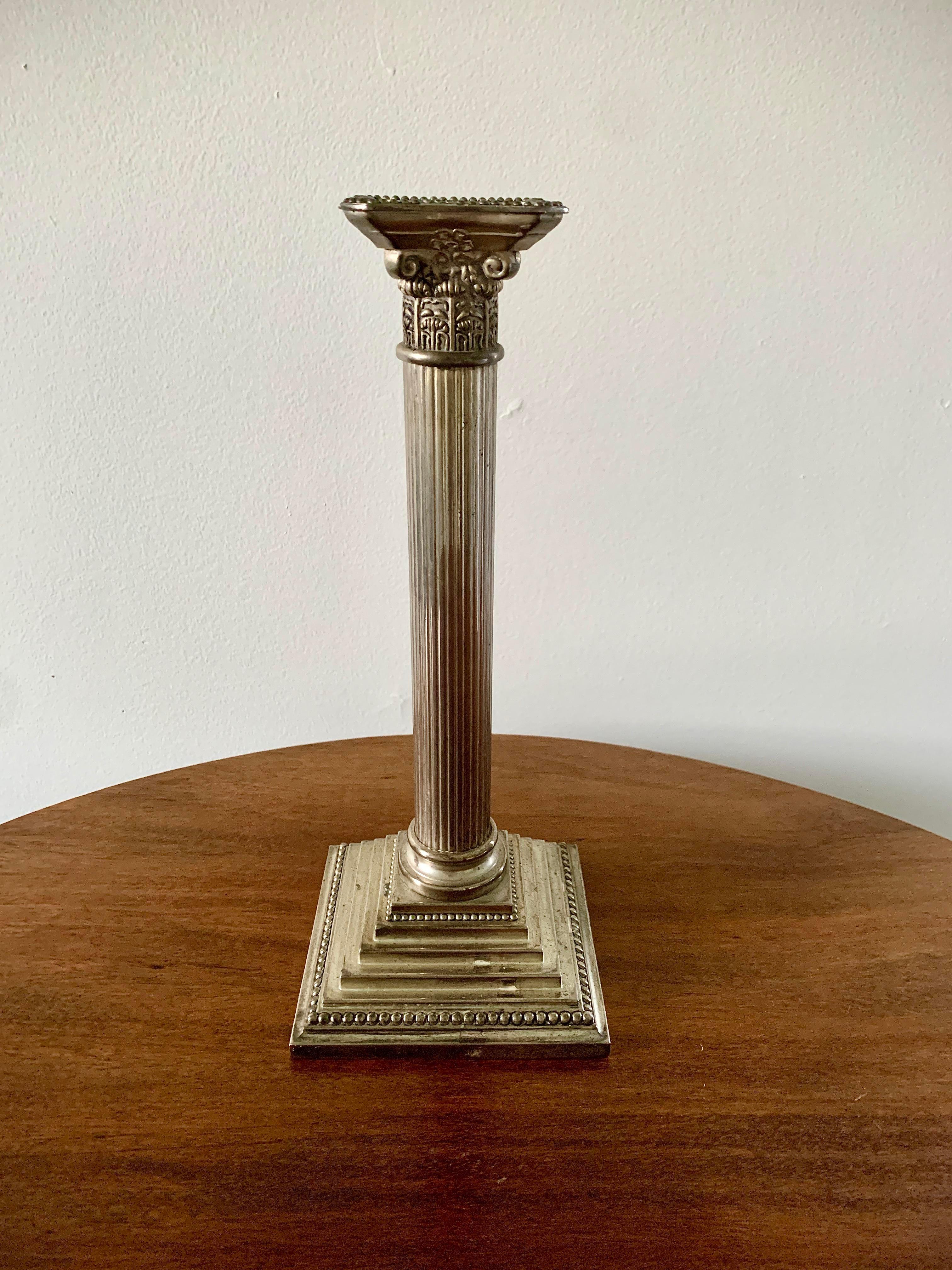 A gorgeous Neoclassical style silver plate corinthian column candle holder

Circa Mid-20th Century

Measures: 5