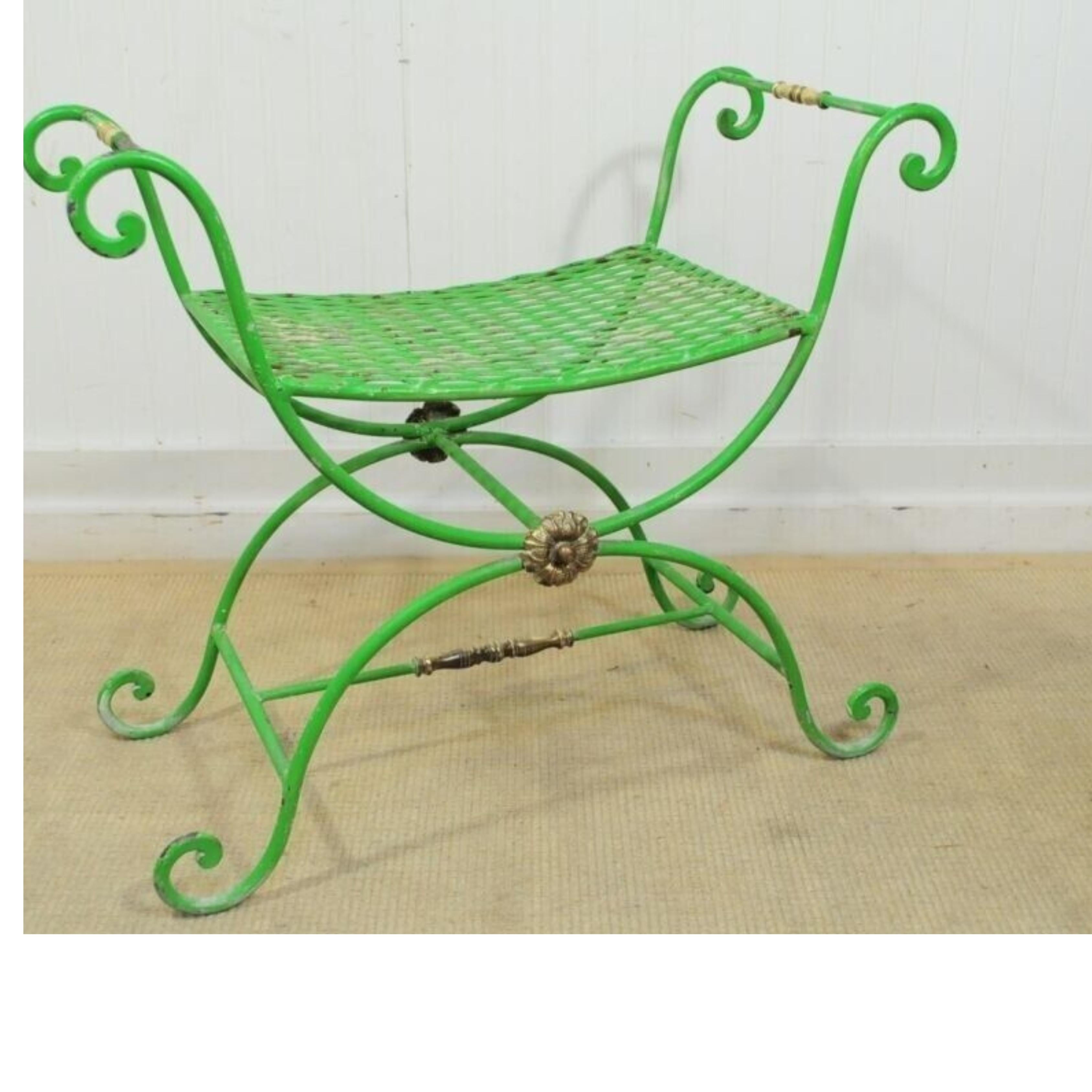 Vintage Neoclassical Style Green Painted Wrought Iron Brass Curule X Bench Stool. Item features distressed painted finish, wrought iron construction, brass accents. Circa Mid to Late 1900s. Measurements: 23