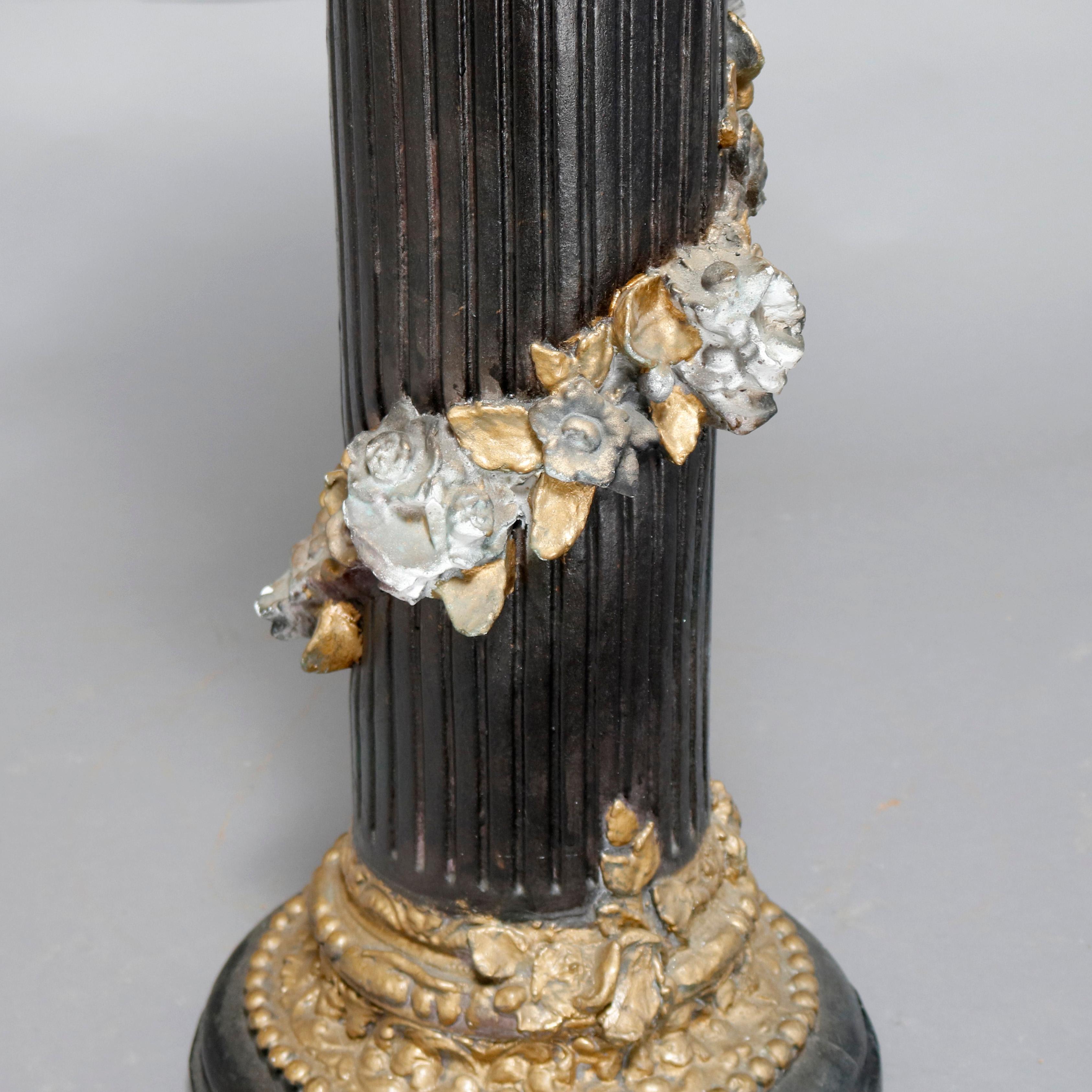 A vintage paint decorated neoclassical style plaster sculpture pedestal offers Corinthian column-form with floral garland wrapped in high relief, painted black, silver and gold, 20th century

***DELIVERY NOTICE – Due to COVID-19 we are employing