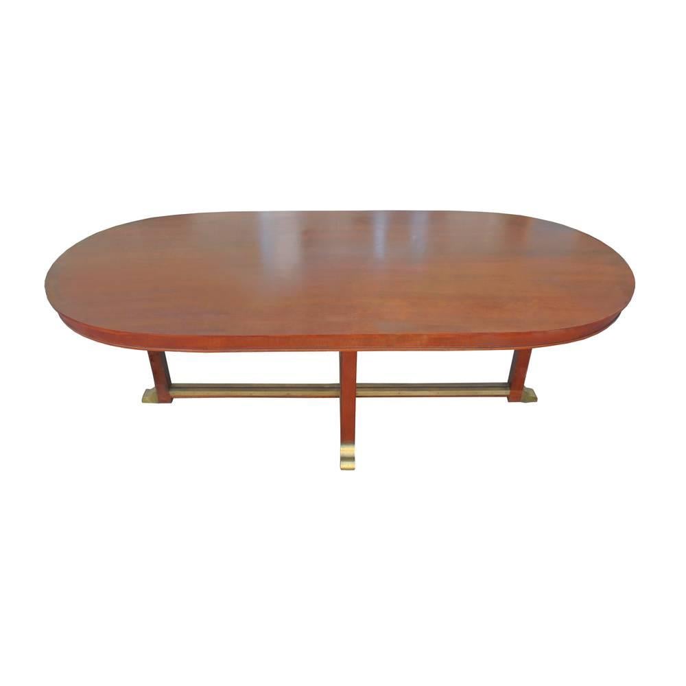 Vintage Neoclassical Style Racetrack Dining Conference Table 


Classical lines in mahogany with brass details at base and feet. 
Racetrack top.