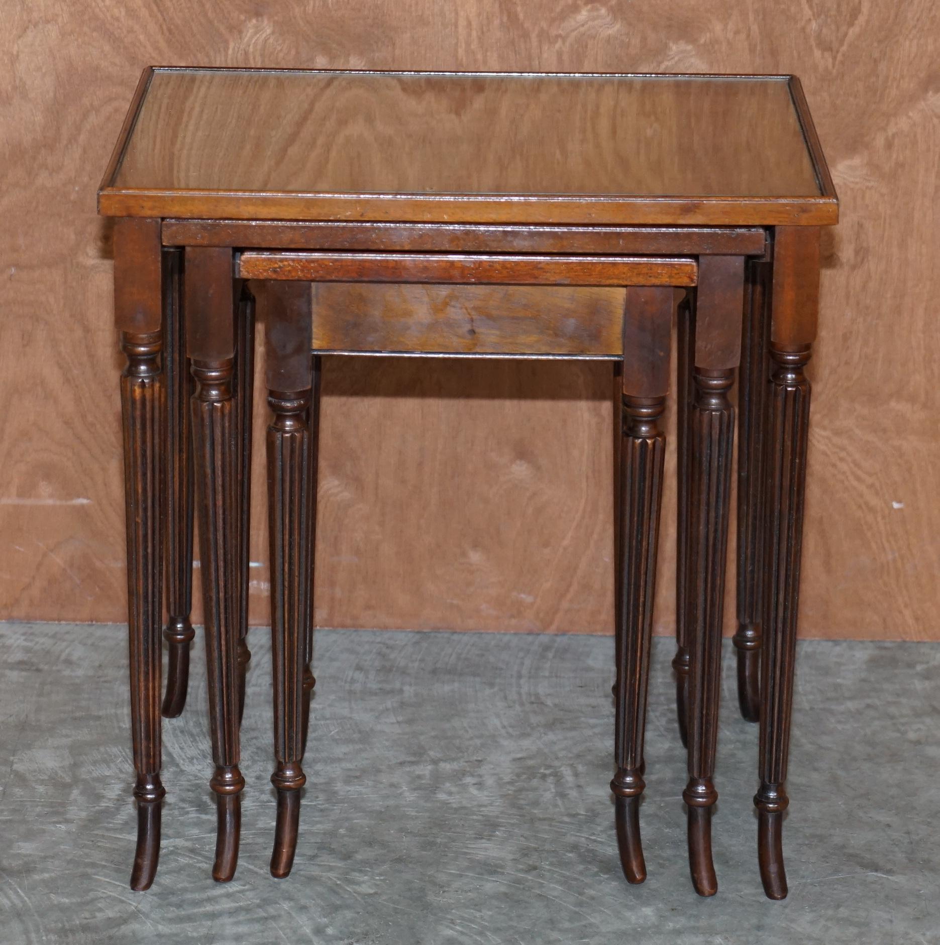 We are delighted to offer for sale this lovely nest of three tables which have flamed mahogany tops protected by glass inserts 

A very good looking and well made nest, the timber patina to the top is very nice

Condition wise the nest has been