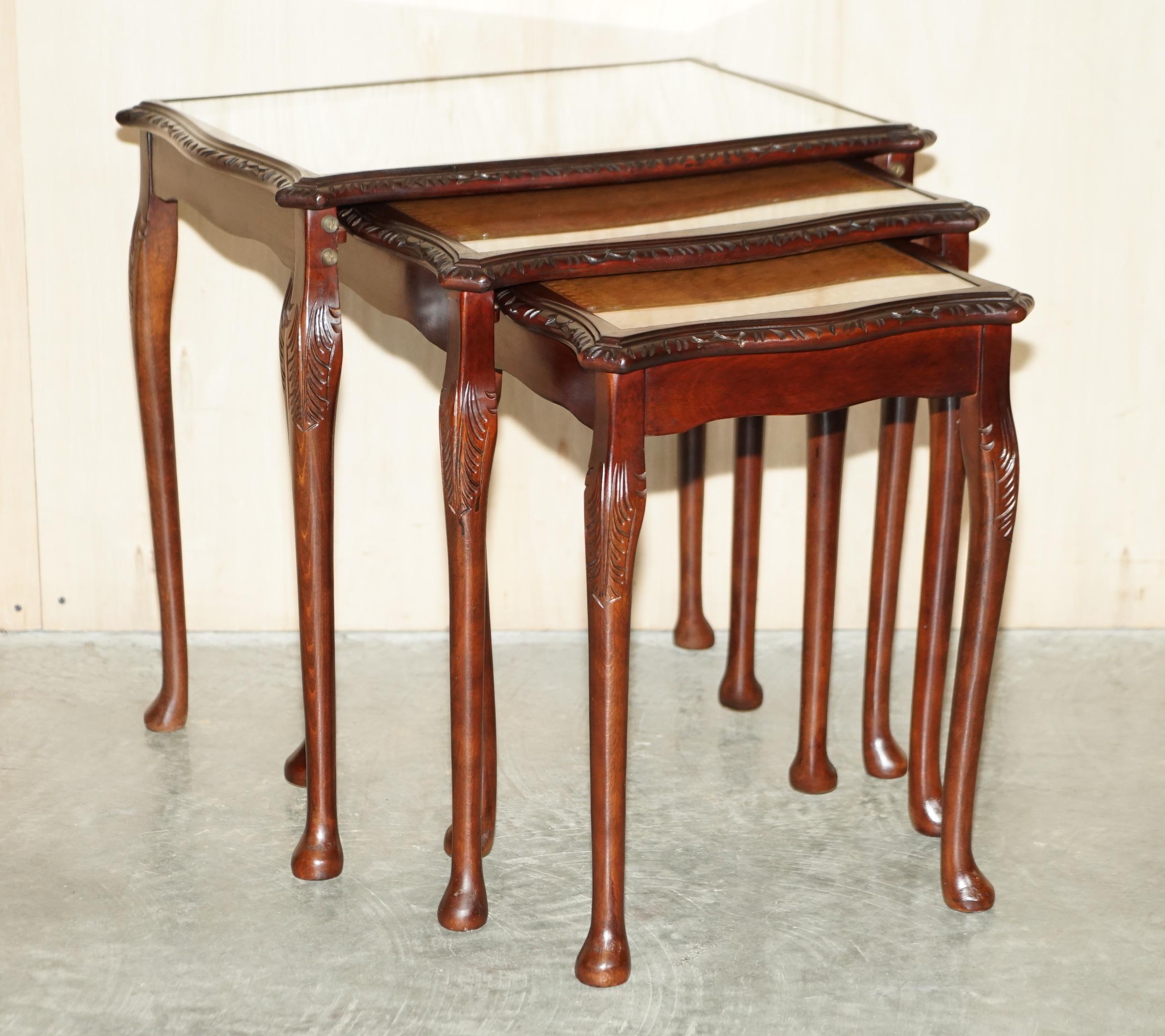 We are delighted to offer for sale this lovely nest of three tables which have gold leaf embossed tan brown leather tops that are protected by glass.

A very good looking and well made nest, each table has a tan leather top which looks very