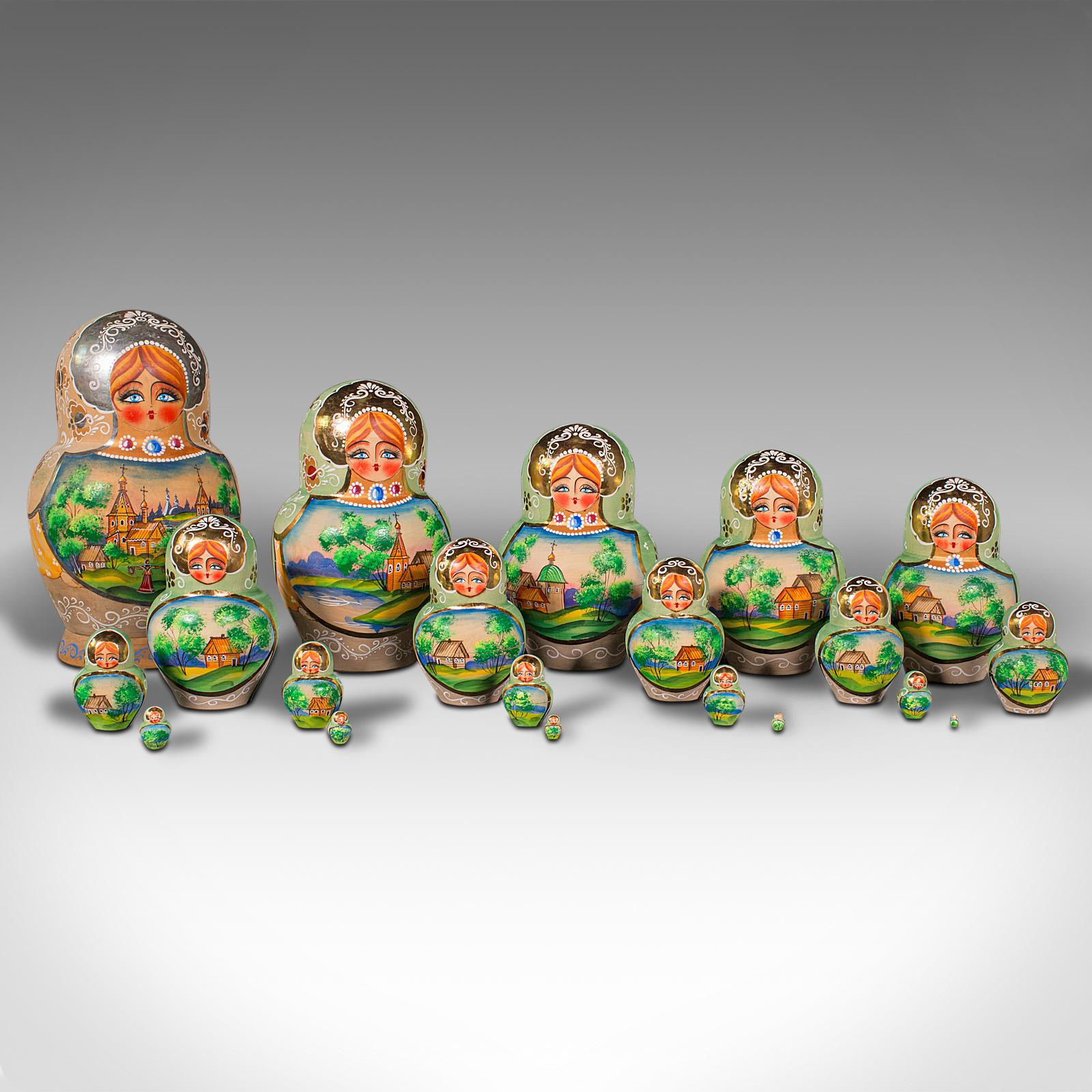 This is a vintage Nesting Doll. A Russian, pearwood hand-painted decorative Matryoshka set, dating to the late 20th century, circa 1990.

Striking 20 doll nesting set with great decor
Displaying a desirable aged patina and in good order
Quality