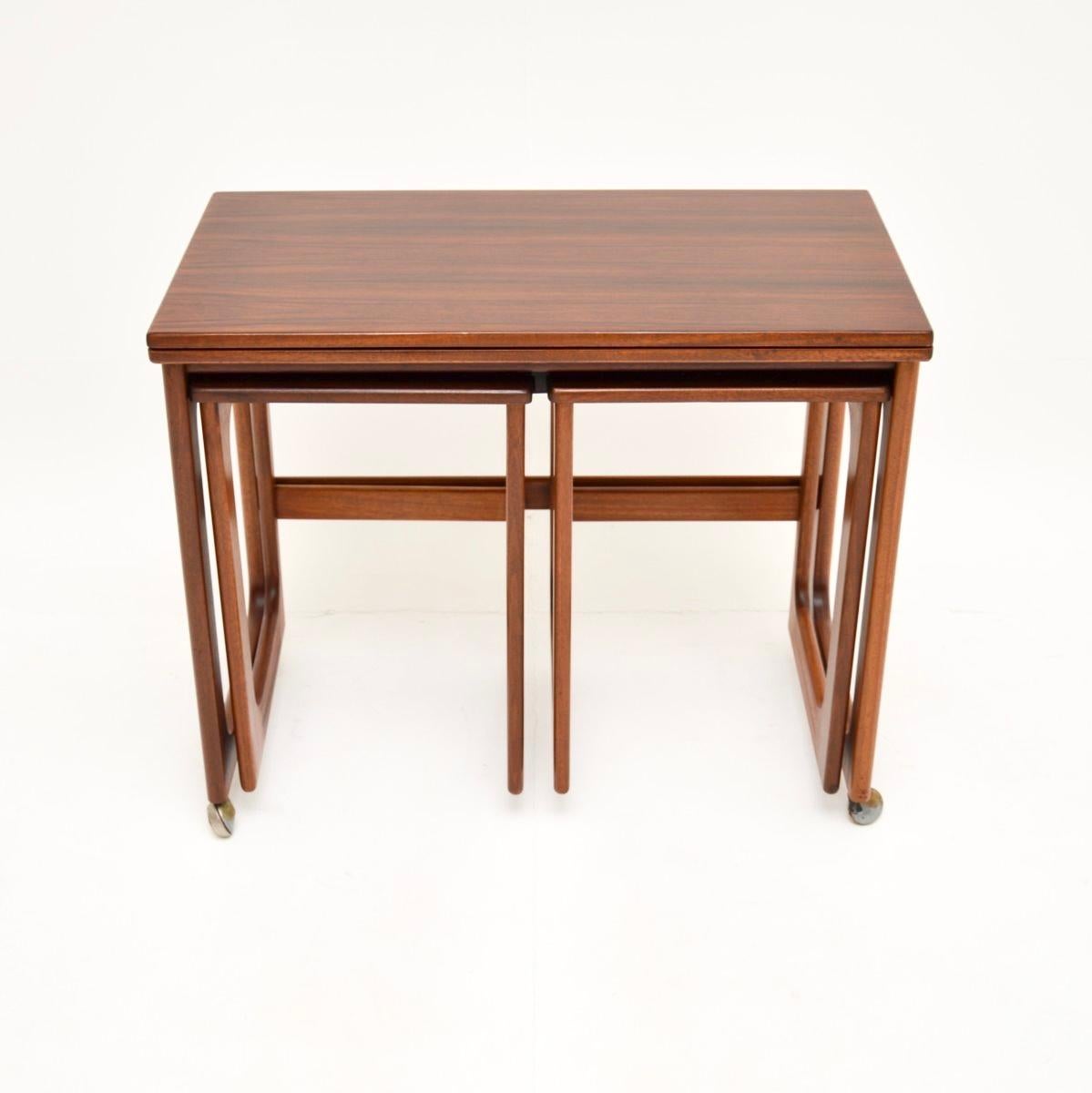 A stylish and very well made vintage nesting side table by McIntosh. This was made in Scotland and dates from the 1960’s.

It is of wonderful quality, it has a smart and useful design. When folded away it serves as a lovely low console / side table.