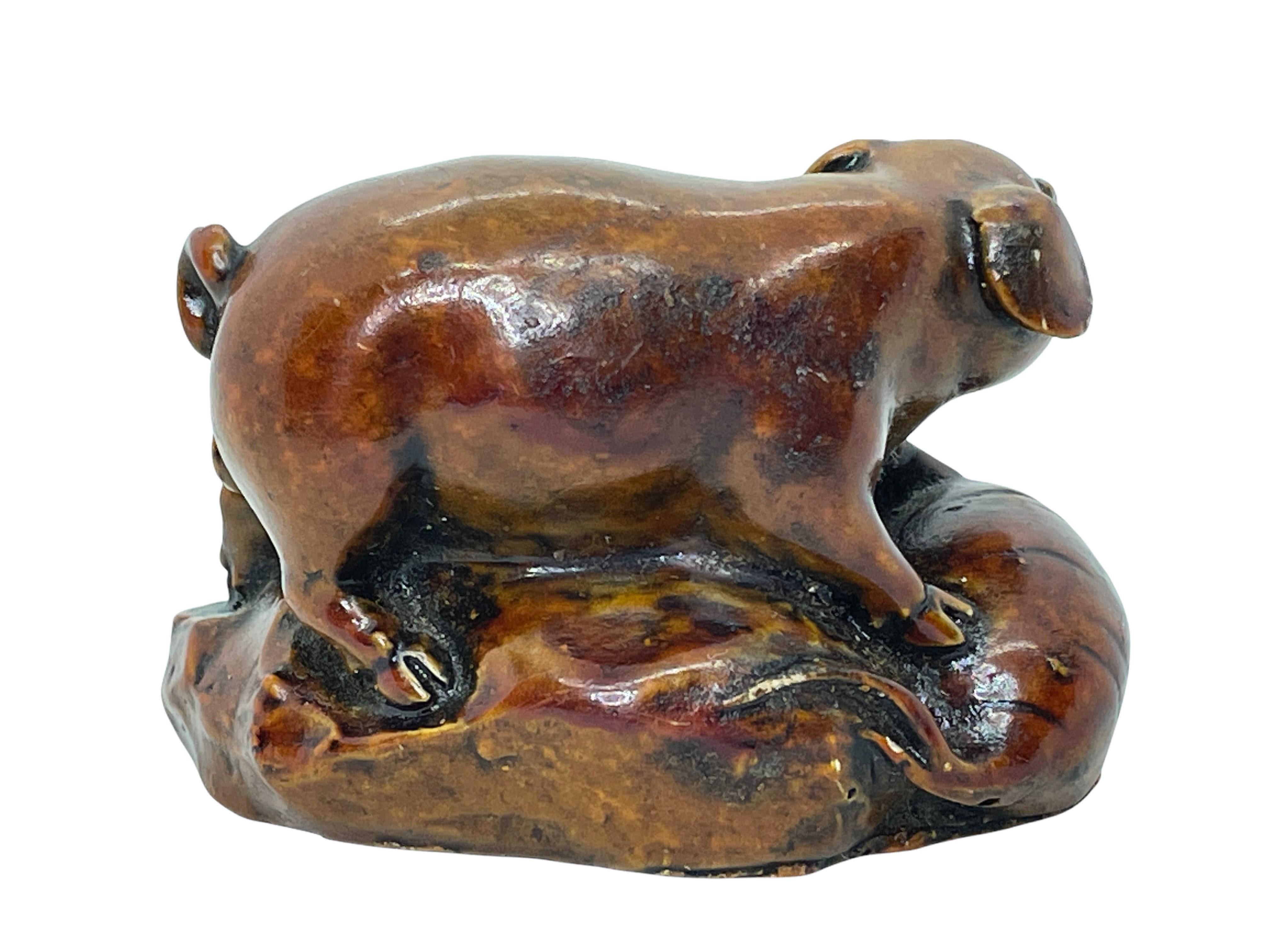 A beautiful small Pig figurine. Some wear with a nice patina, but this is old-age. Made probably of soapstone or resin. A beautiful nice desktop item or just a display item in your collections of souvenirs from around the world.