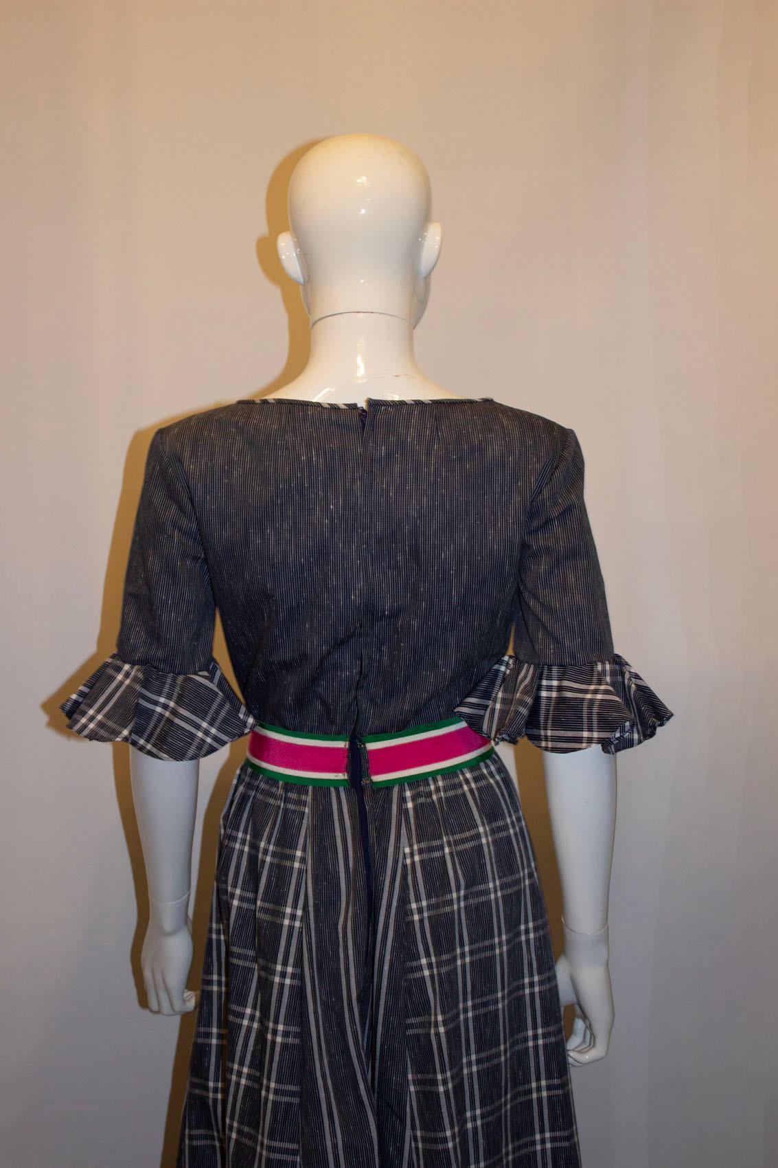 A great dress for Spring /Summer by Netti Vogue.
In a fun mix of blue and white stripe and check with a pink and green waistband. The dress has a scoop neckline, frill detail on the sleave and is lined.
Measurements Bust 36'', length 58'' plus 2''