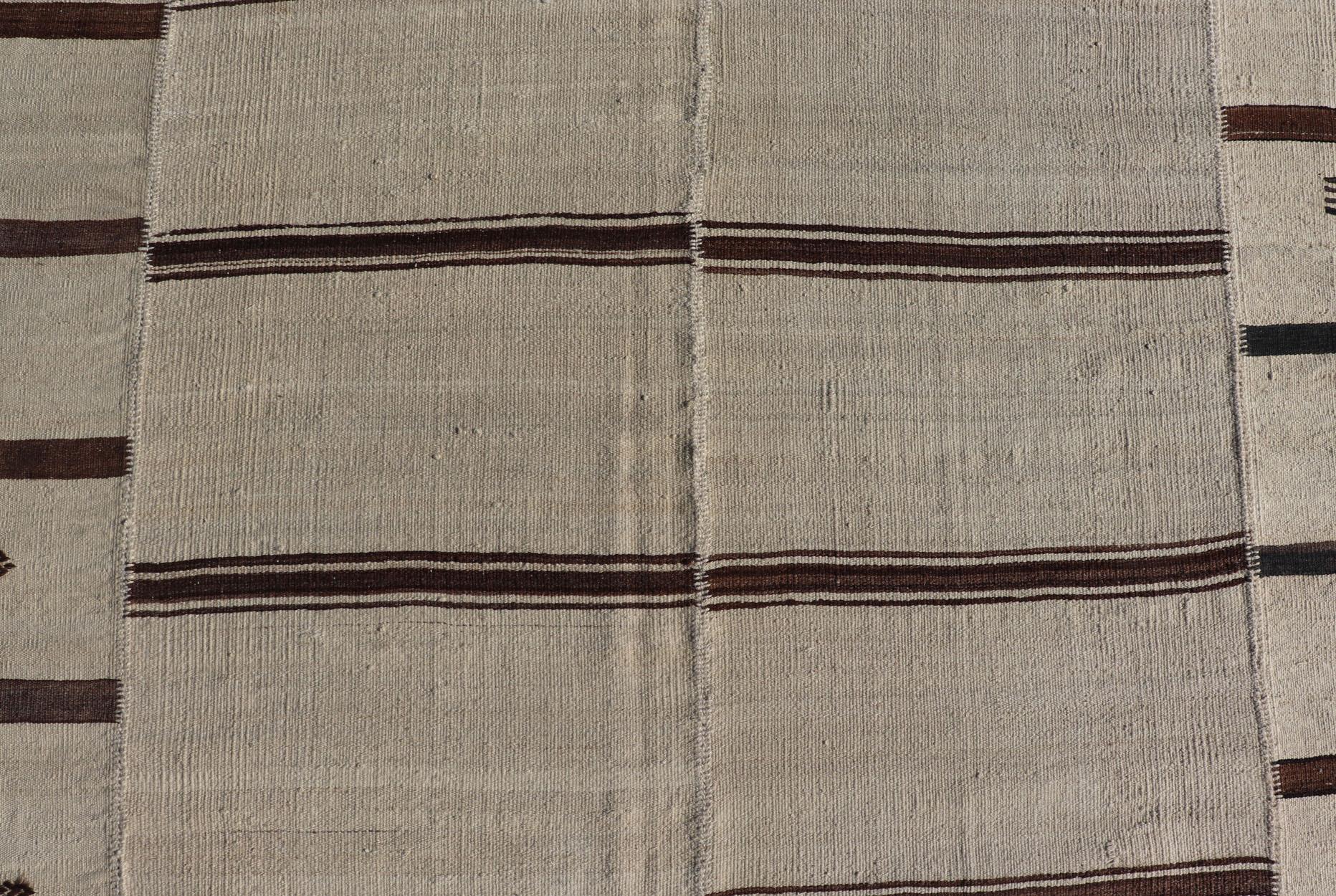 Large Vintage Hand Woven Neutral Paneled Kilim Flat-Weave in Tones of Cream and Brown.

Measures: 13'3 x 18'1

Large Vintage Hand Woven neutral paneled Kilim flat-weave in tones of cream and brown in stripe design  kwarugs, Casual flat-weave Kilim