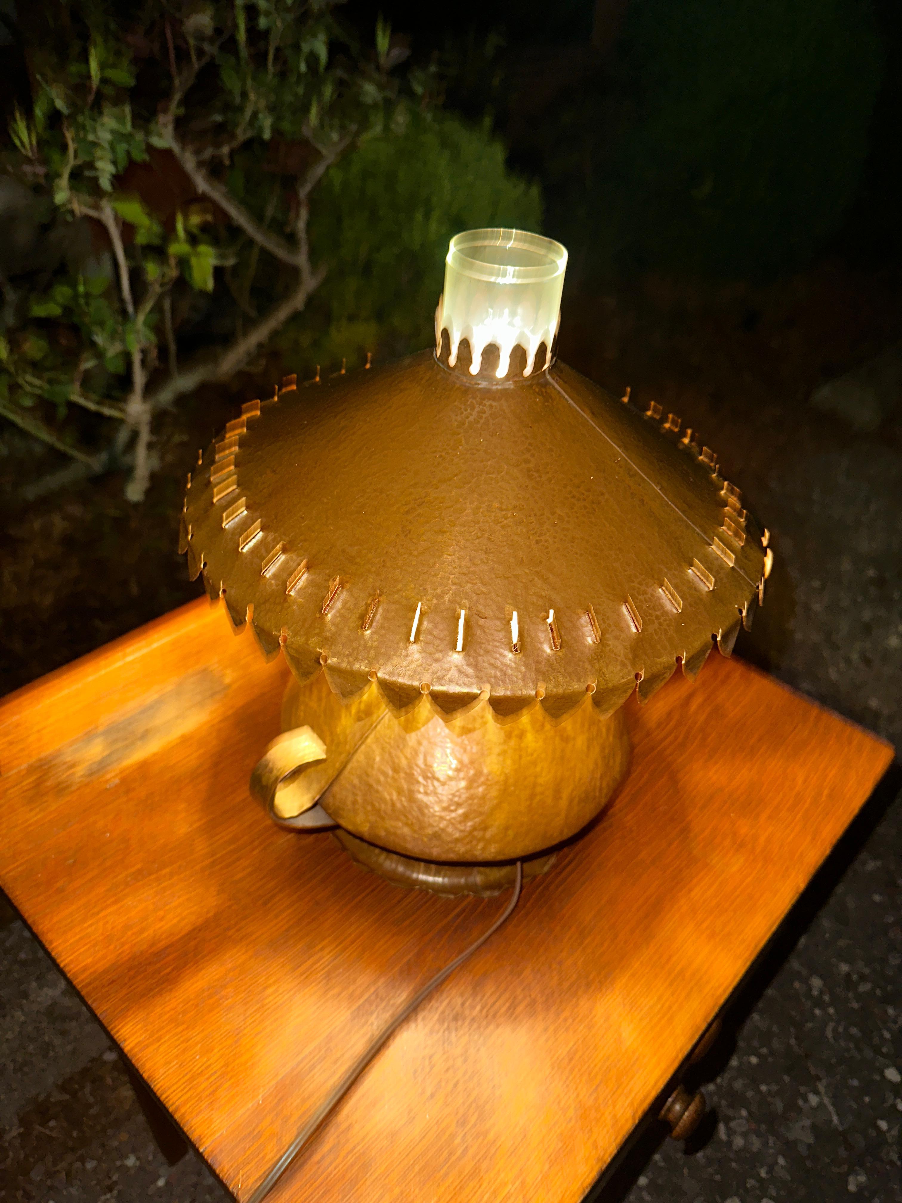 Vintage Nice Hammered Cooper Arts & Crafts Table Lamp

This is a nice hand-hammered copper table lamp made in the 1950s. It is in good condition.  Shipping for this item will be $175.00.