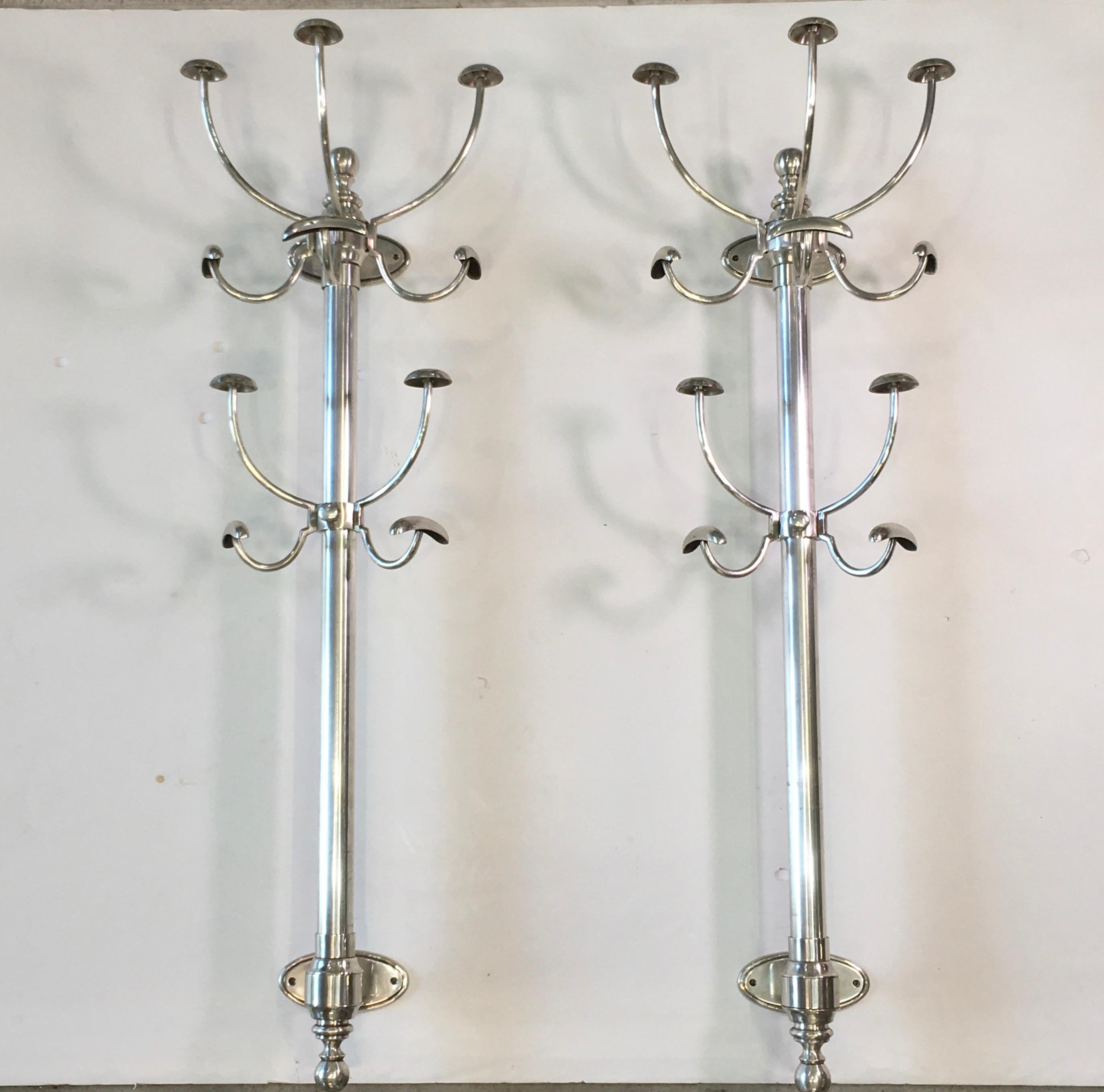 A single bracket mounted coat & hat tree made of nickel plated brass.
This is high quality and heavy duty, like what you would have found in an old world gentleman's club. 
The lower set of hooks is height adjustable and simply slides up or down