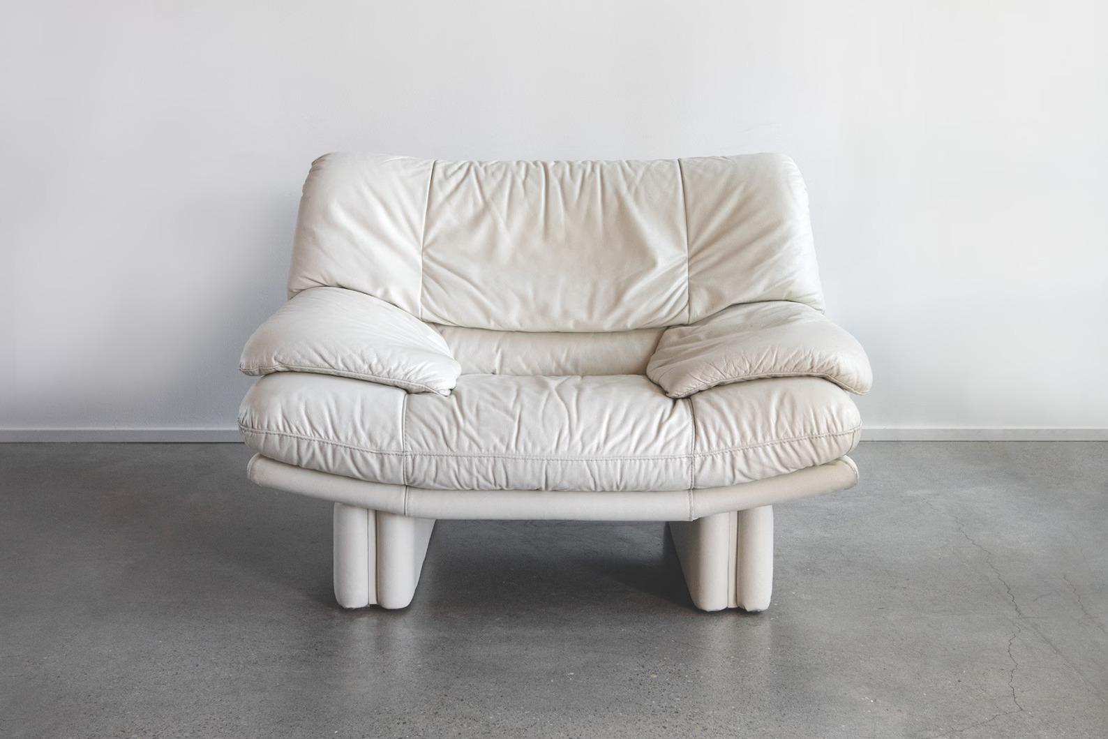 Sink in and feel like you're on a cloud with this stunning postmodern Nicoletti Salotti Italian leather chair in gorgeous a off-white cream. A statement piece in your living room or anywhere you decide to put it. Would pair nicely with modern day,