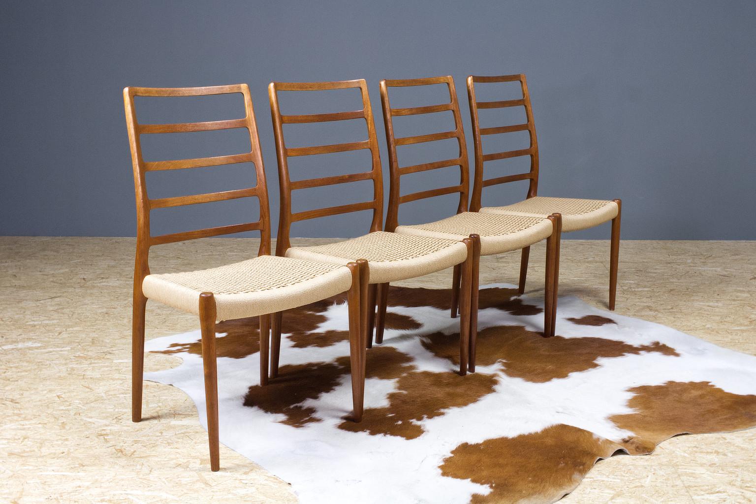 Organically shaped high back dining room chairs, model 82, designed in 1954 by Niels O. Moller for J.L. Møller Møbelfabrik.

The set of 4 is in excellent condition. The seating has been completely renewed. In extreme good condition.

All chairs