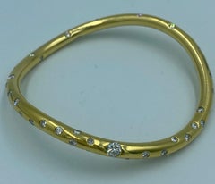 Brazalete asimétrico vintage Niessing de oro de 18k y diamantes