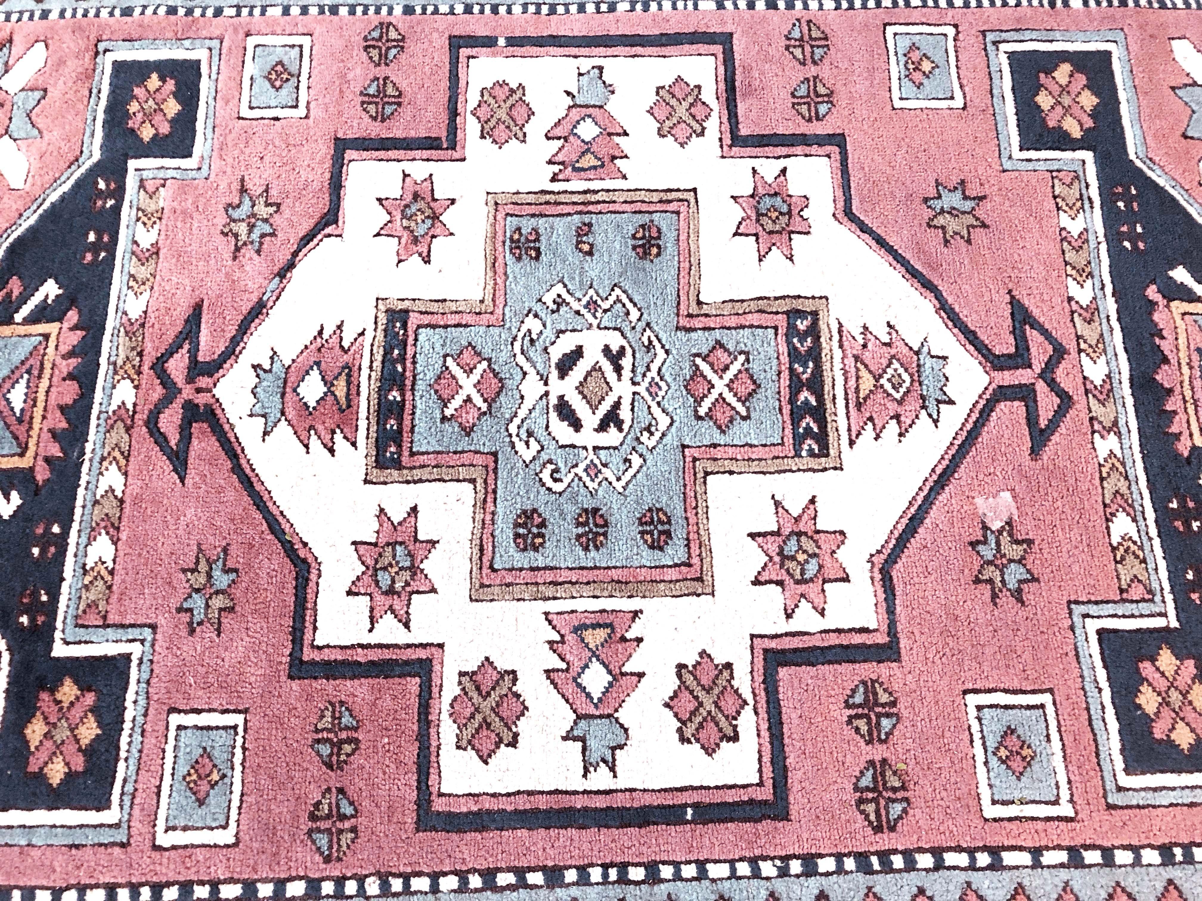 A beautiful rug with traditional Kars motifs, earth tones and pastel colors, produced in Nigde in Eastern Anatolia, Turkey.

One owner. Purchased in 1985. Wool on wool.

Please note: 6 ft x 8 ft dimensions exclude the braided fringe.