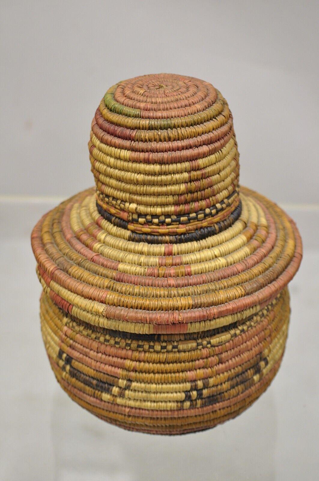 Vintage Nigerian African Tribal Hausa Woven orange basket with Dome lid. Item features a hand woven basket with lid. Circa Mid 20th Century. Measurements: 7.5