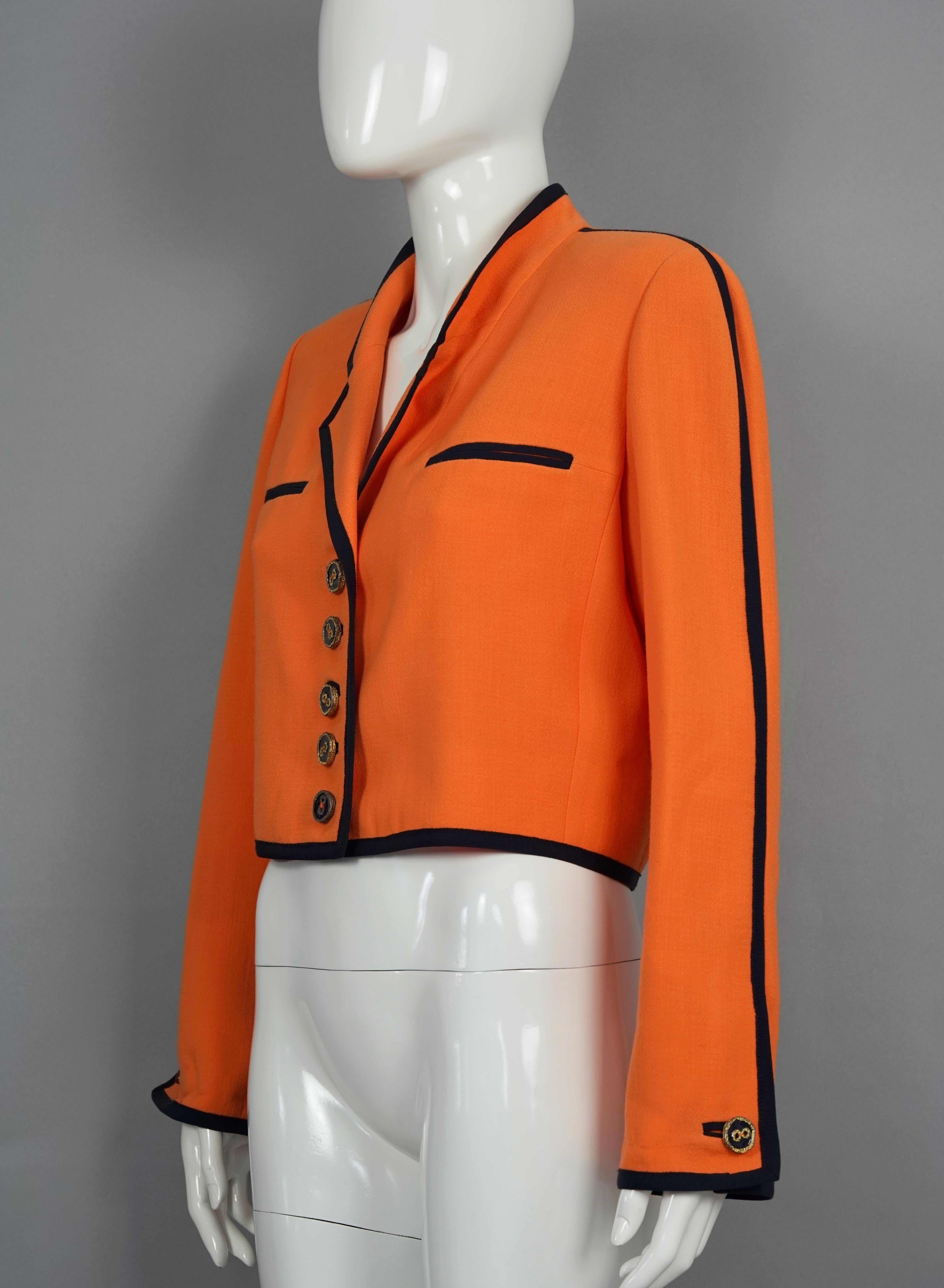 Vintage NINA RICCI Edition Boutique Orange Crop Jacket

Measurements taken laid flat:
Shoulder: 15.35 inches (39 cm)
Sleeves: 24 Inches (61 cm)
Bust: 19.29 inches (49 cm)
Hem: 15.74 inches (40 cm)
Length: 18.50 inches (47 cm)

Features:
- 100%