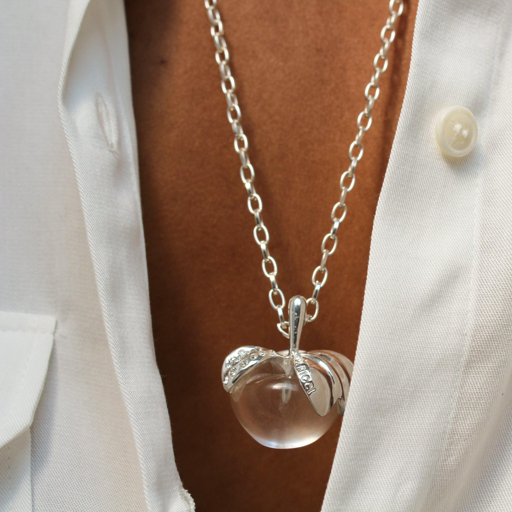 Vintage Nina Ricci Silver Plated Necklace, 1990s

A long silver plated chain necklace featuring a cute little glass apple pendant.

The Nina Ricci haute couture house was founded in 1932 by Maria Nina Ricci in Paris. She became famous for her