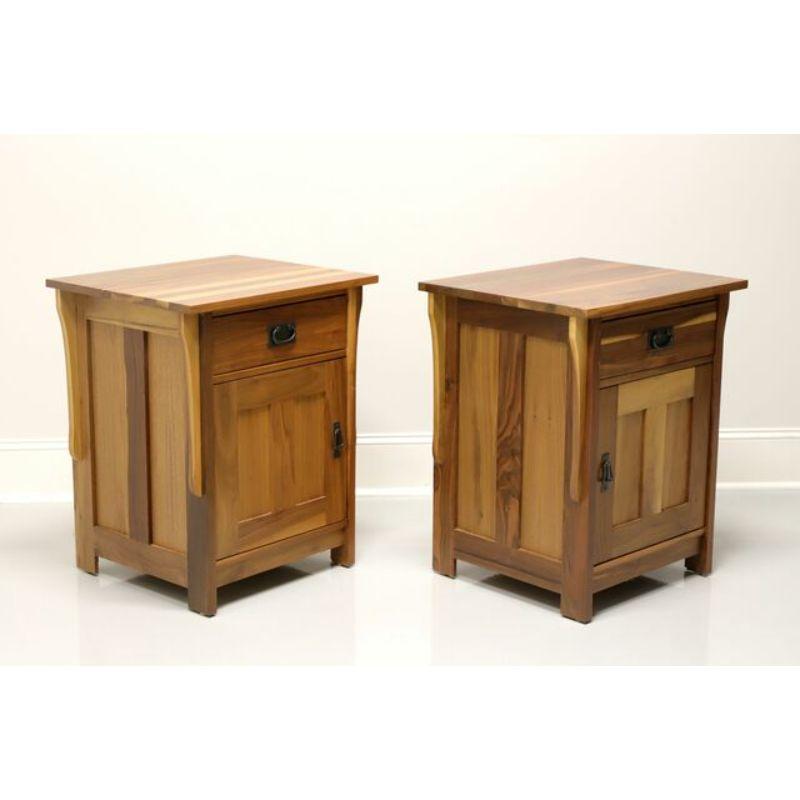 A pair of Mission Arts & Crafts style nightstands by Noble Furniture. Solid cedar with metal hardware. Features one drawer of dovetail construction over a single door cabinet revealing storage with one adjustable wood shelf. Made in the USA, in the