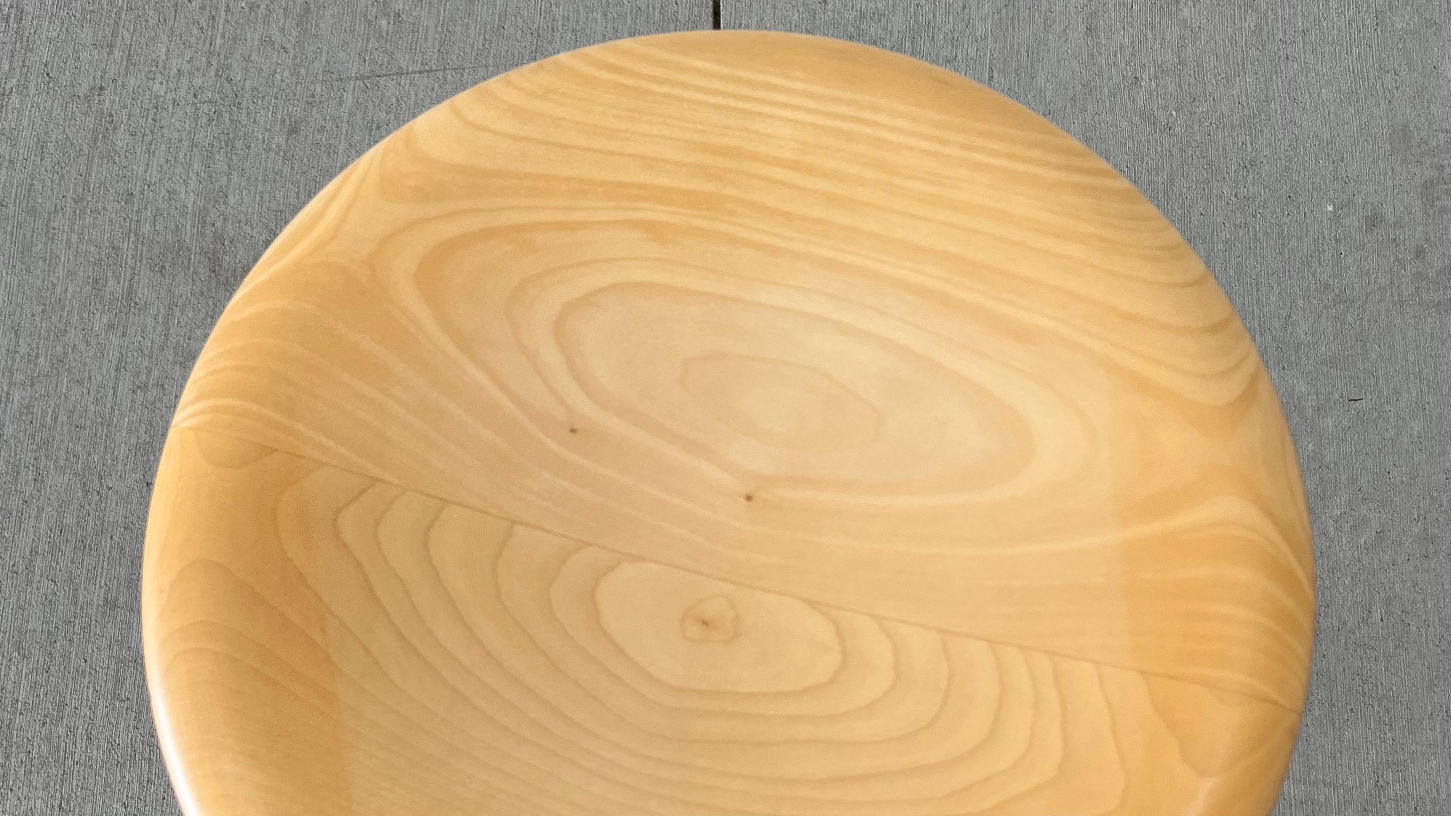 Isamu Noguchi iconic rocking stool in blond wood with polished chrome accents, 14” diameter x 17”high. Vitra production. Short dark example not included, available in a separate listing. 
