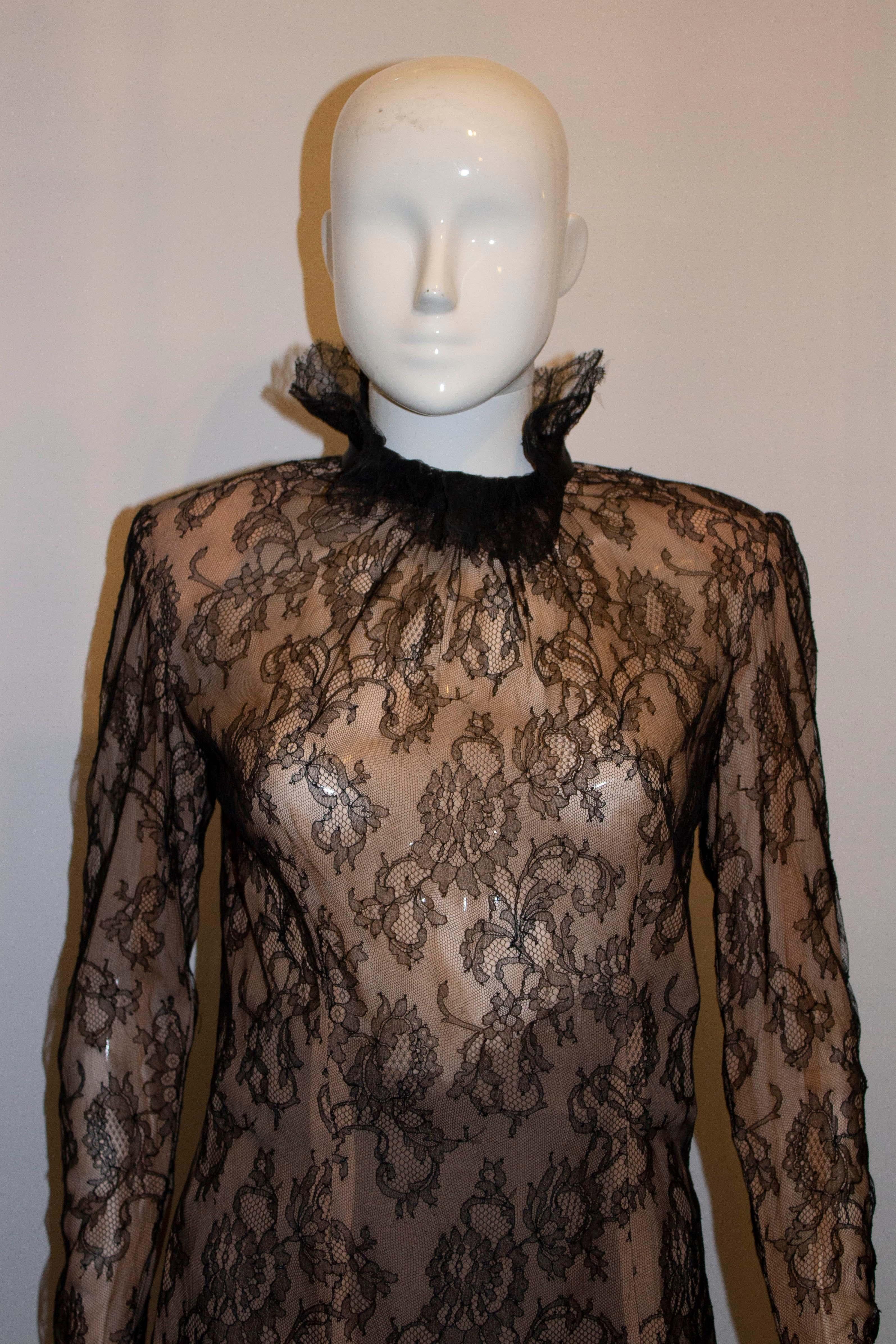A pretty and chic lace blouse by Nolan Miller Couture. The lace top has a blush/nude lining with frill and ribbon at the neck. It has a back zip opening.
Measurements: Bust 36 '', length 27''