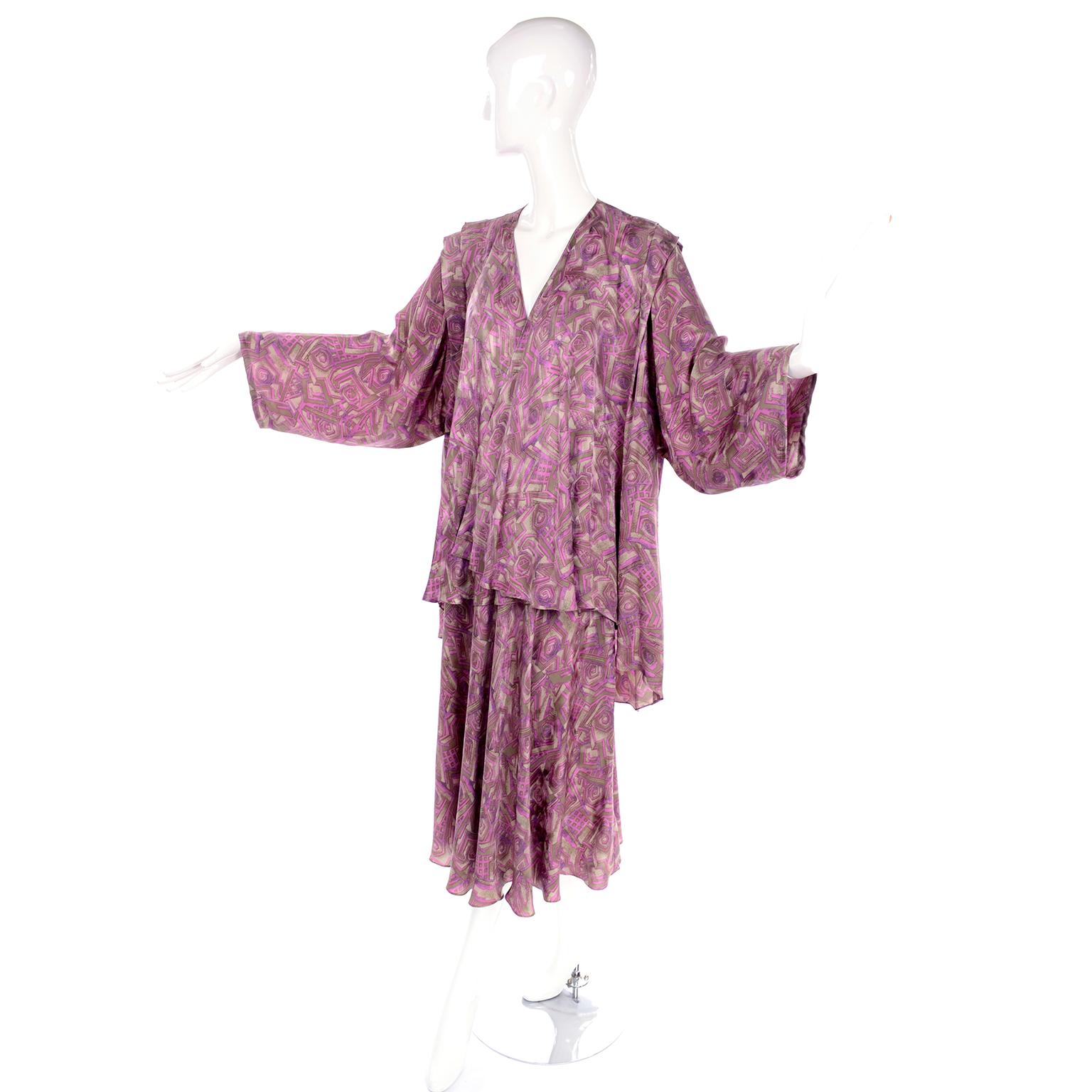 This is a fabulous vintage 2 piece dress ensemble from Korean designer, Nora Noh.  The fabric is an abstract pattern in gold/taupe and pink / purple silk.  The outfit is a great dress alternative and includes two separate pieces that can be worn on