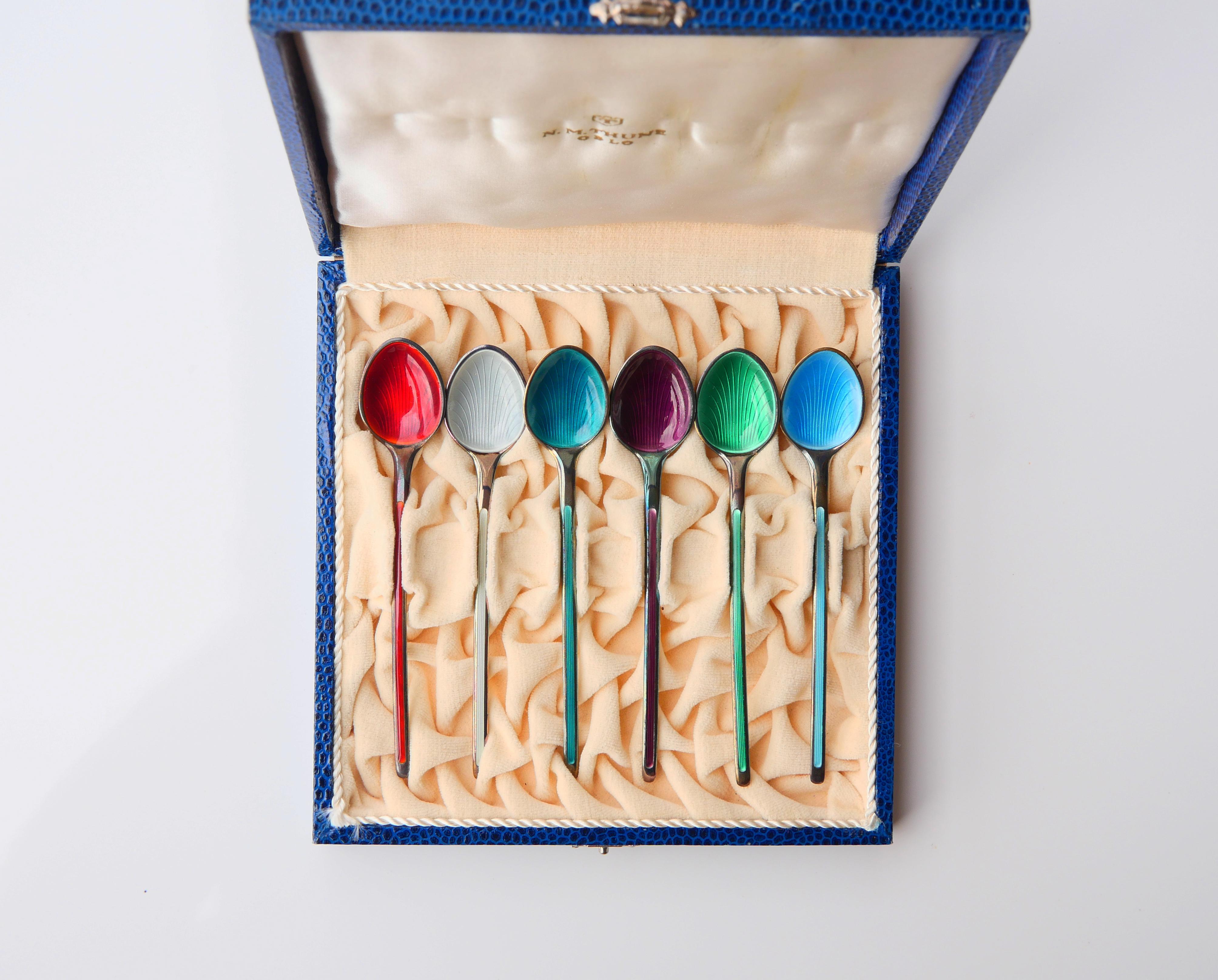 
Vintage set of fine tea/ ice - cream spoons solid Gilt 925 grade Silver decorated with translucent Guilloche Enamels.  Hand - made at the workshop of M.N Thune in Oslo, Norway ca 1960s. Hallmarked with maker's hallmarks that confirm solid 925 