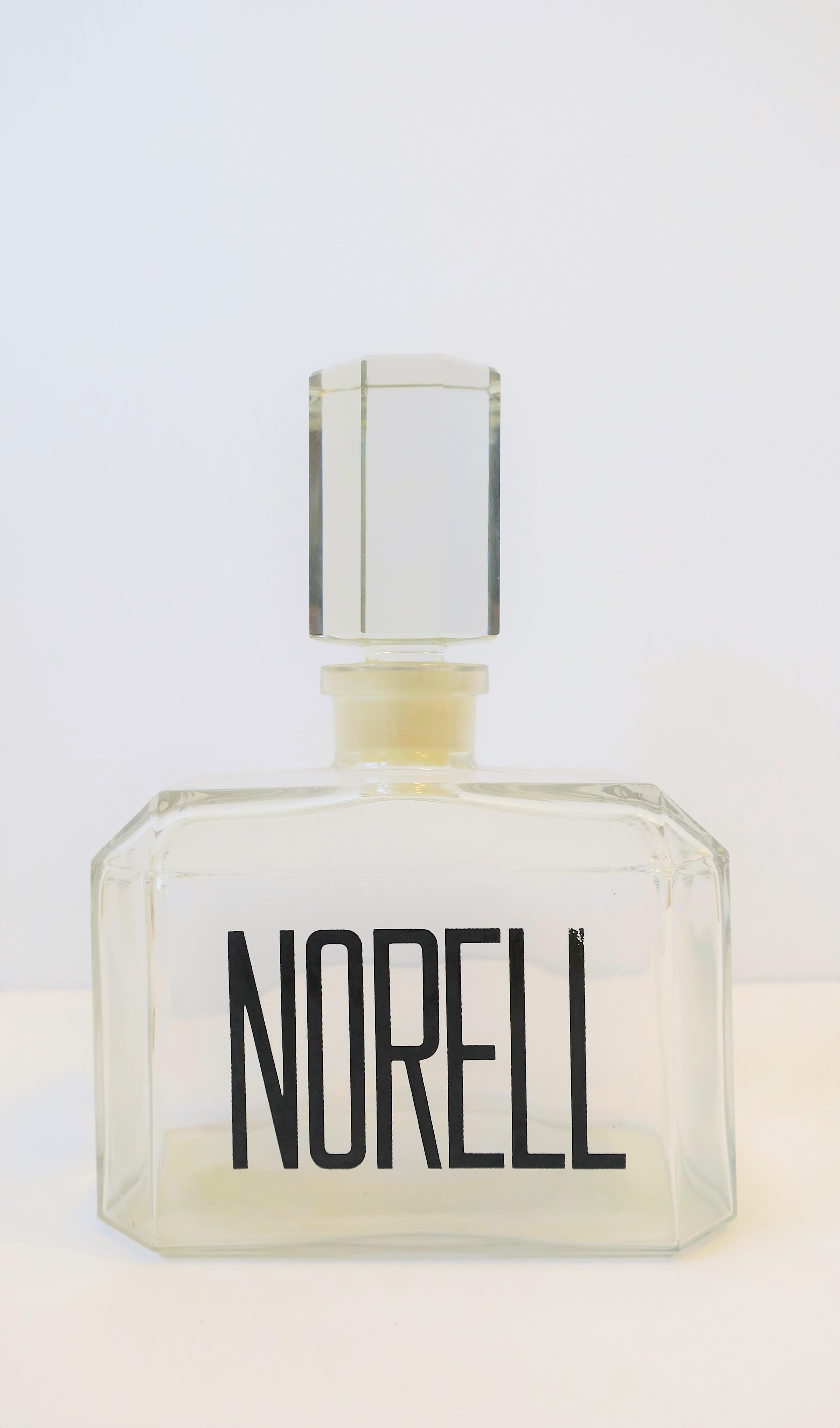 A beautiful vintage relatively large Norell perfume glass vanity bottle, circa 1960s-1970s. Norell perfume was created by American fashion designer 'Norman Norell' in 1968. By the mid-twentieth century Norell dominated the American fashion industry
