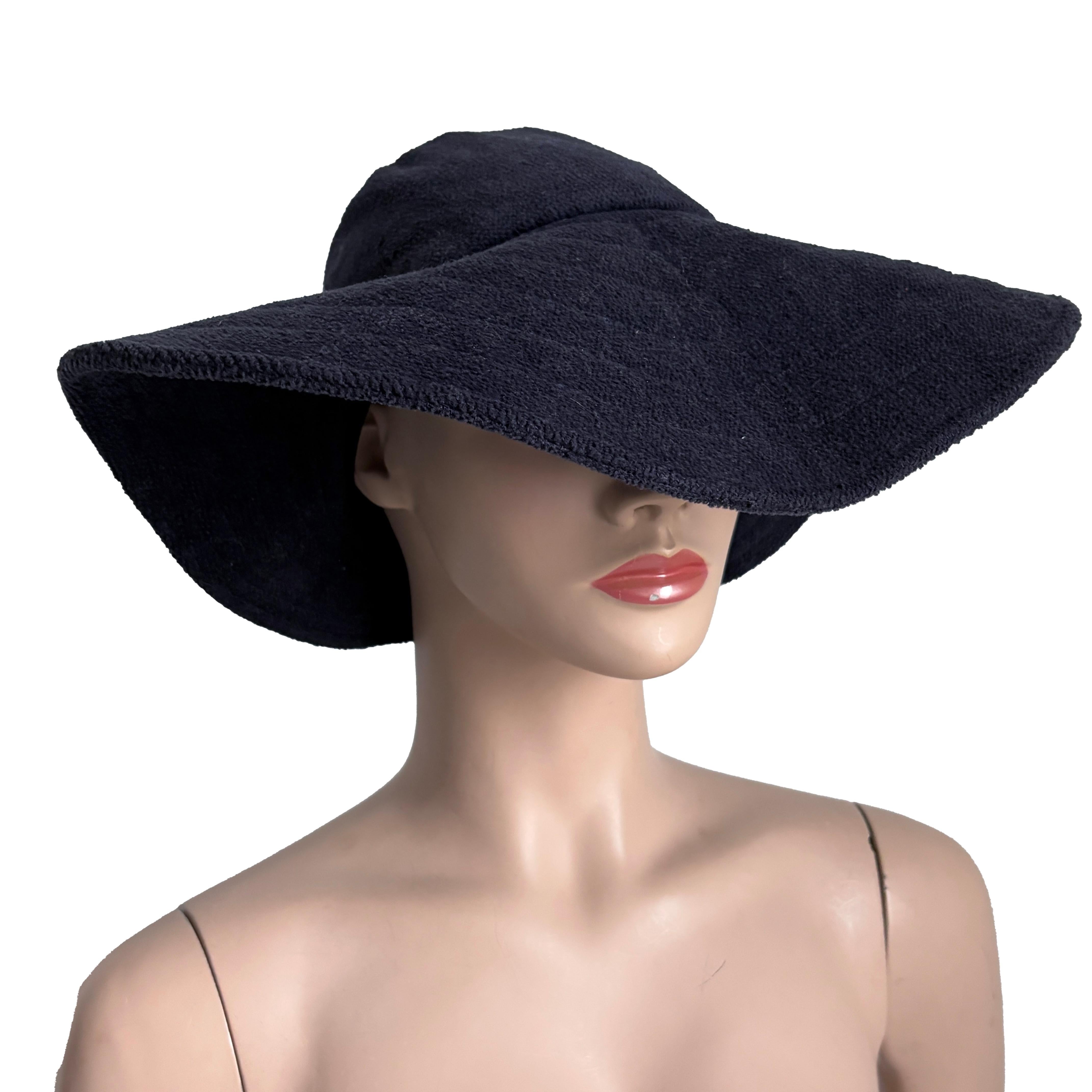 Preowned, vintage wide brim hat, designed by Norma Kamali for Stetson, most likely in the 1980s.  Made from soft navy Terry cloth, it's unlined and features a wide and floppy front brim! 

Perfect for your beach getaways and pool parties!  And it's