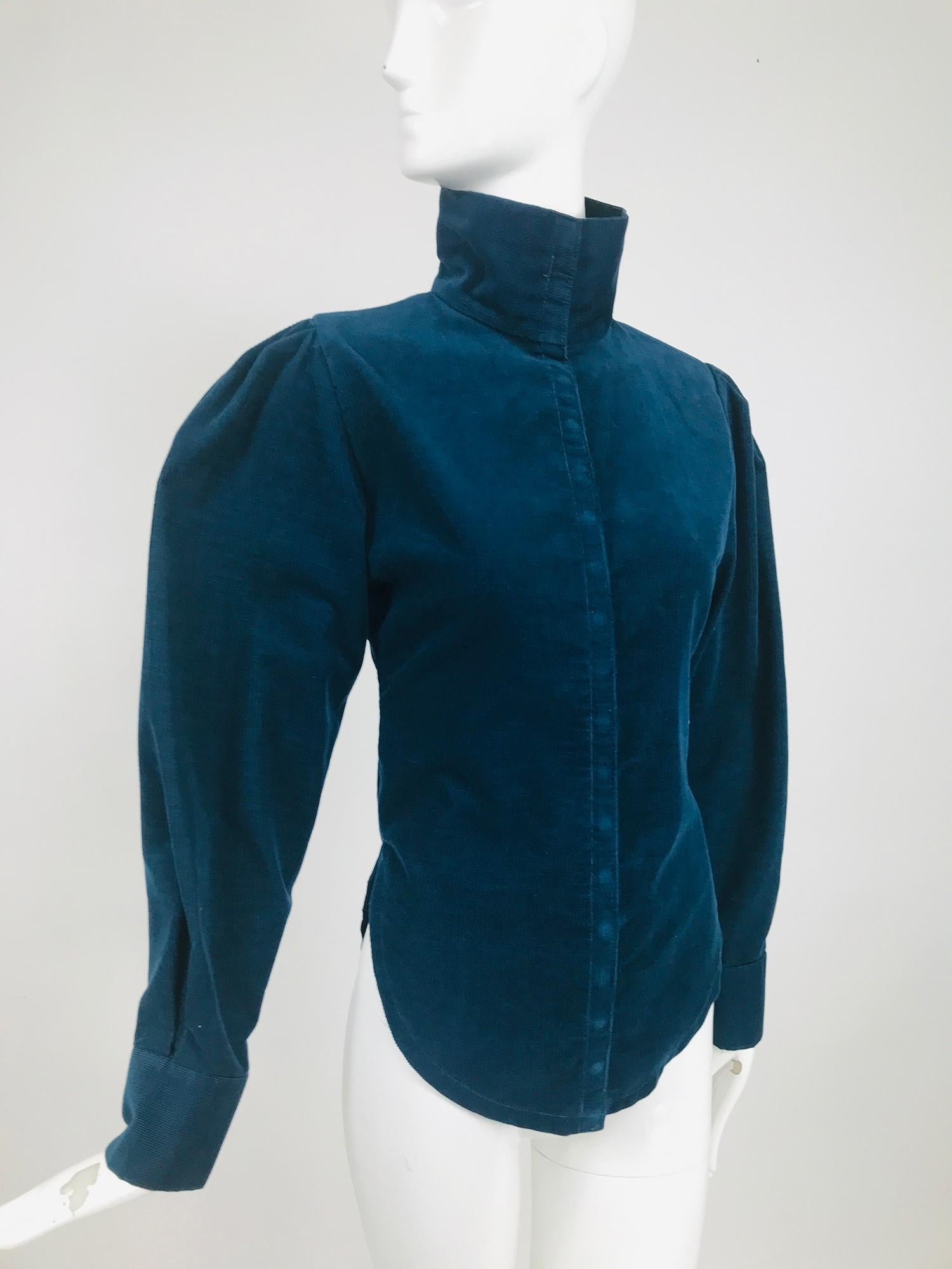Vintage Norma Kamali teal blue corduroy, high neck fitted shirt from the 1980s. Beautiful teal blue pin wale corduroy fitted shirt, high neckline, leg O mutton sleeves, narrow torso and shirt tail hem. A modern take on a Victorian blouse. The top