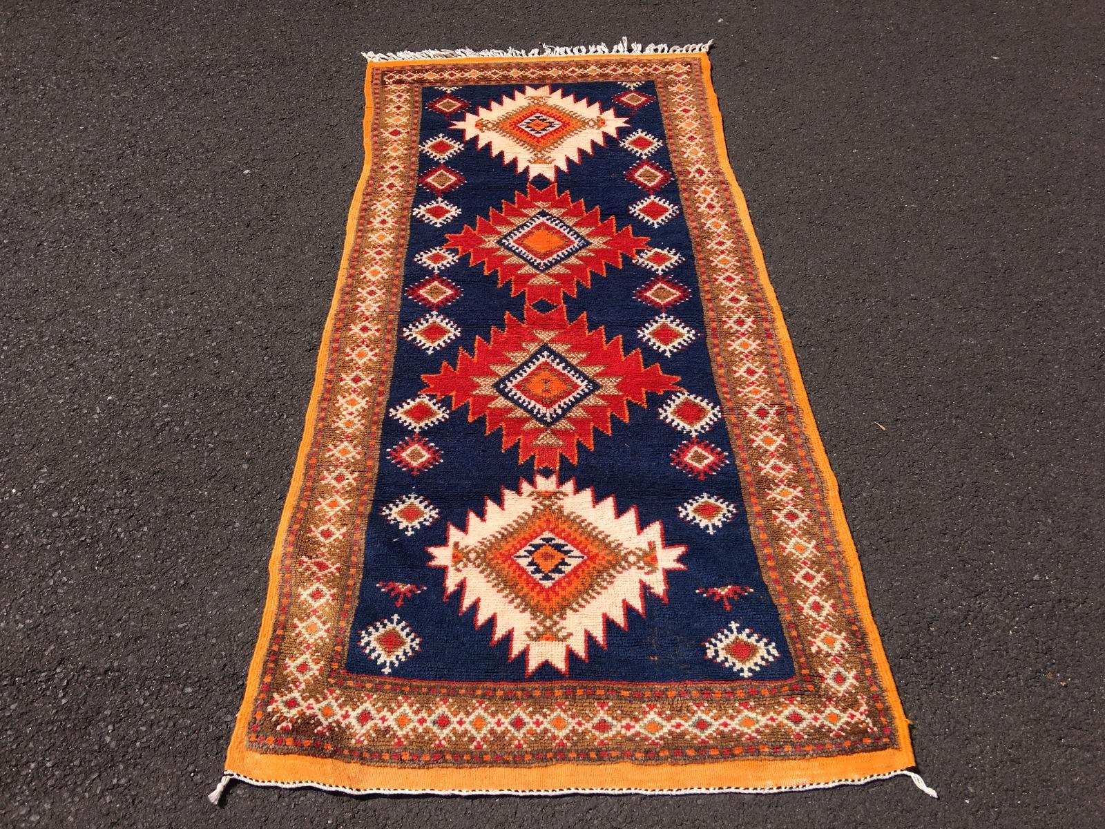 Beautiful hand knotted rug from North Africa. This great vintage piece was made by women of the Berber Ait Khozema tribe in Morocco. These people are at home in the Atlas mountains, living at an altitude of about 5000-6000 ft. The weather is very