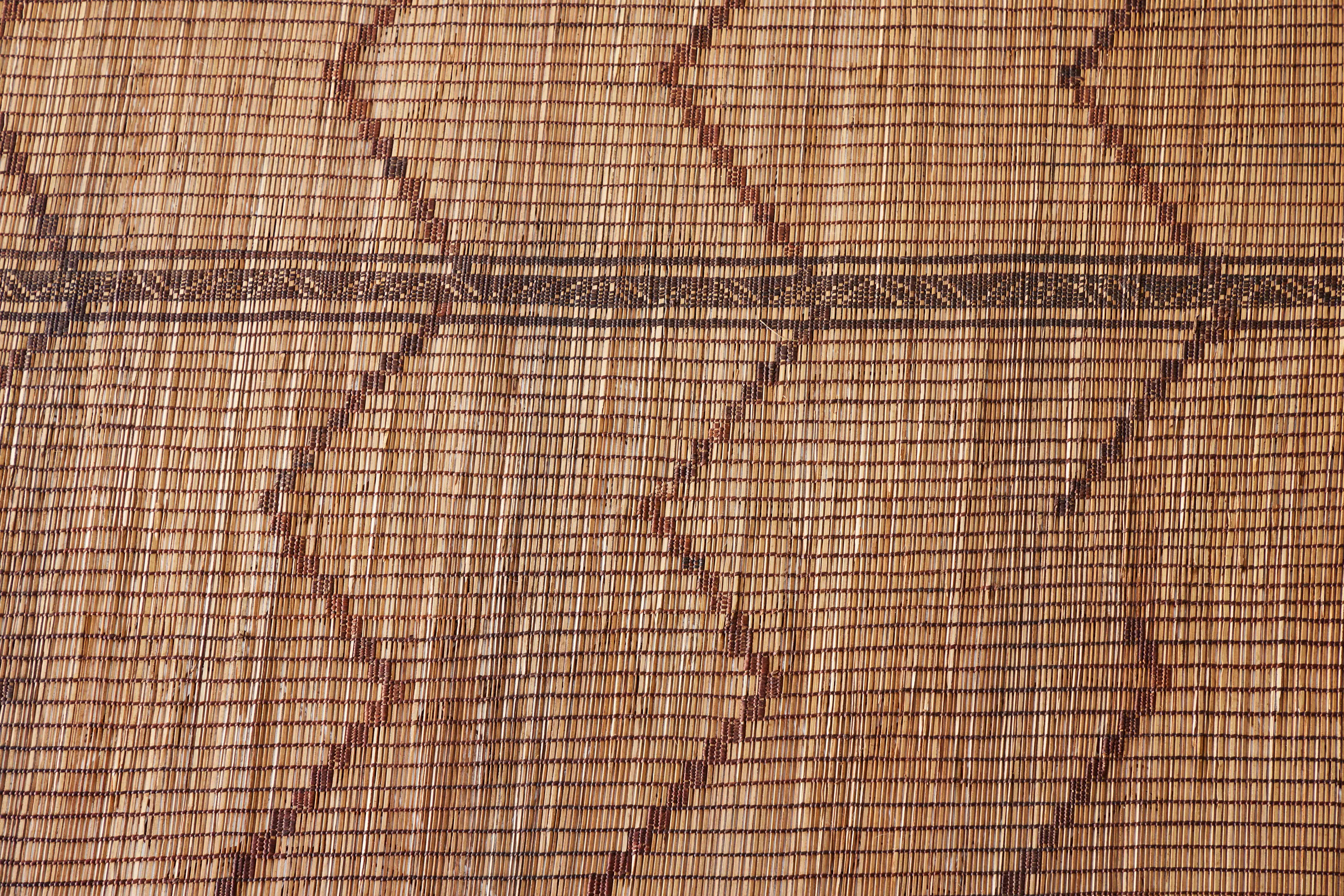 A very unique Tuareg will elevate any design space with its tribal design and striking texture. This piece is handwoven by the Tuaregs, the oldest nomadic groups of the Saharan trade routes located in Northern Africa. These mats are handwoven by