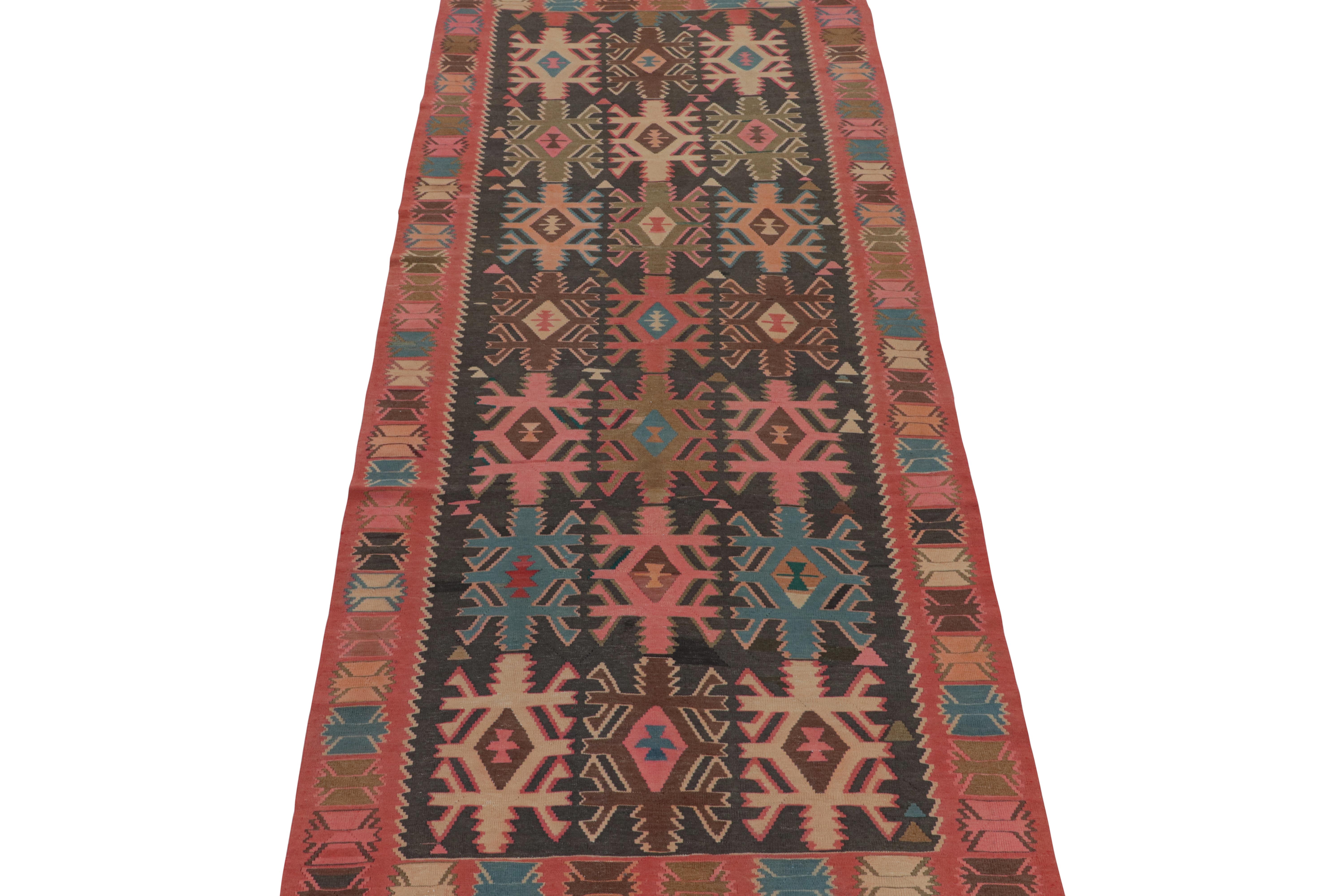 This vintage 5x13 Persian Kilim is a tribal rug from Meshkin—a small northwestern village known for its fabulous works. Handwoven in wool, it originates circa 1950-1960.

Further on the Design:

The bold design prefers a black field and salmon red