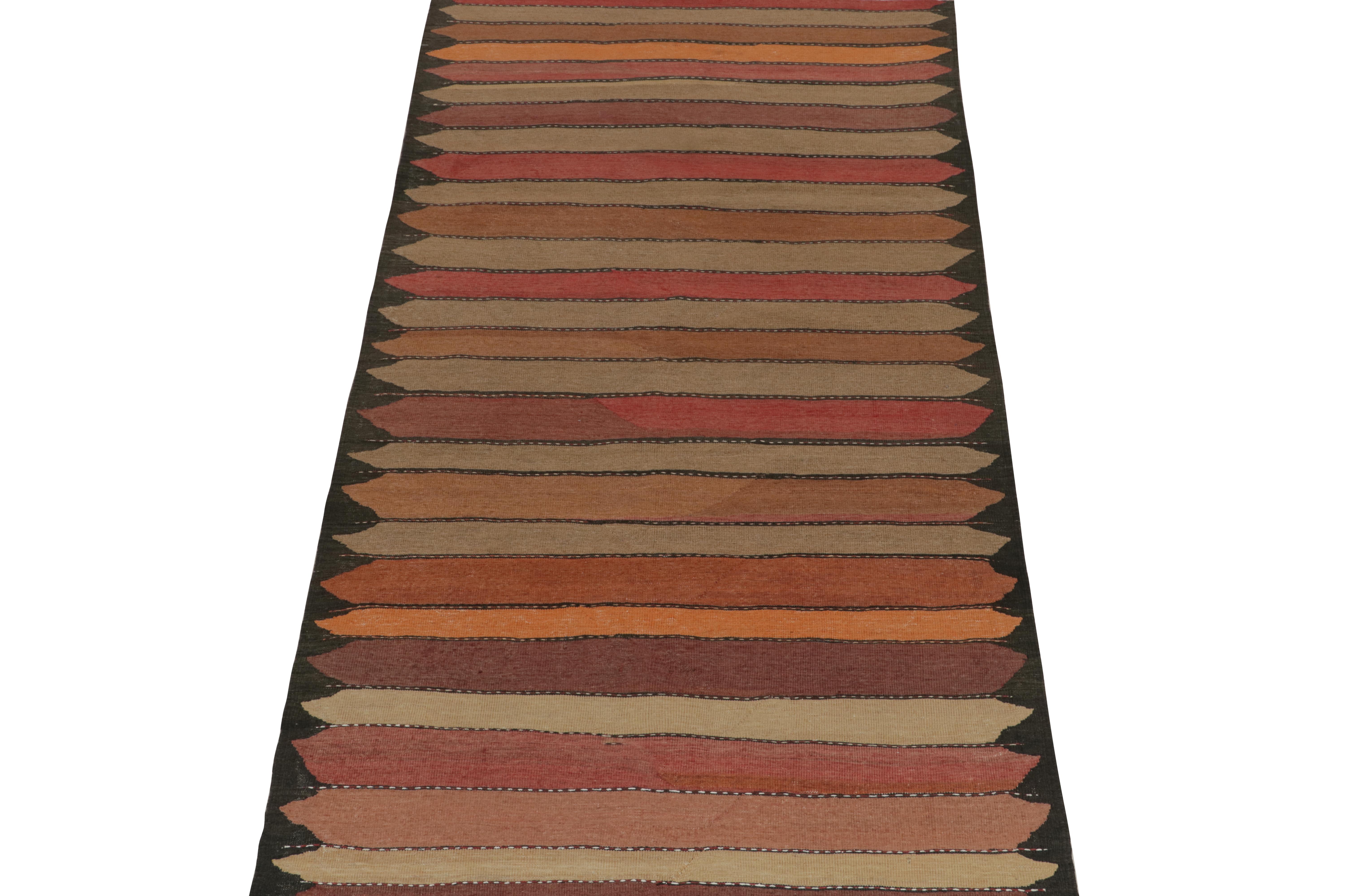 This vintage 5x11 Persian Kilim is a unique tribal rug for its period that hails from Northwestern provenance. Hand-knotted in wool, it’s believed to originate from Azerbaijan circa 1950-1960.

Further on the Design:

A deep brown undertone