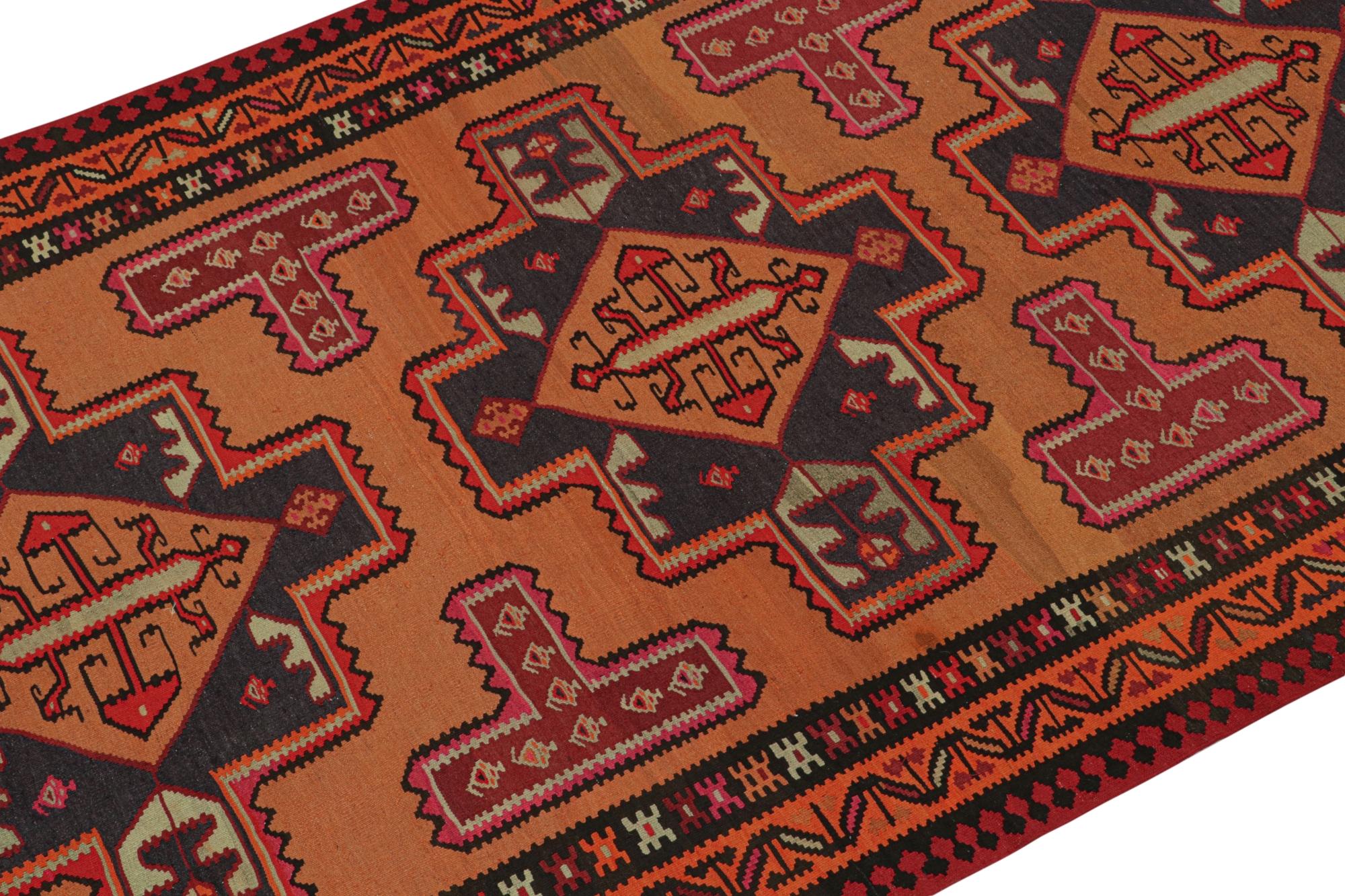 This vintage 6x10 Persian Kilim is a tribal rug from Meshkin—a small northwestern village known for its fabulous works. Handwoven in wool, it originates circa 1950-1960.

On the Design:

The design enjoys rich and warm tones of orange, pink,