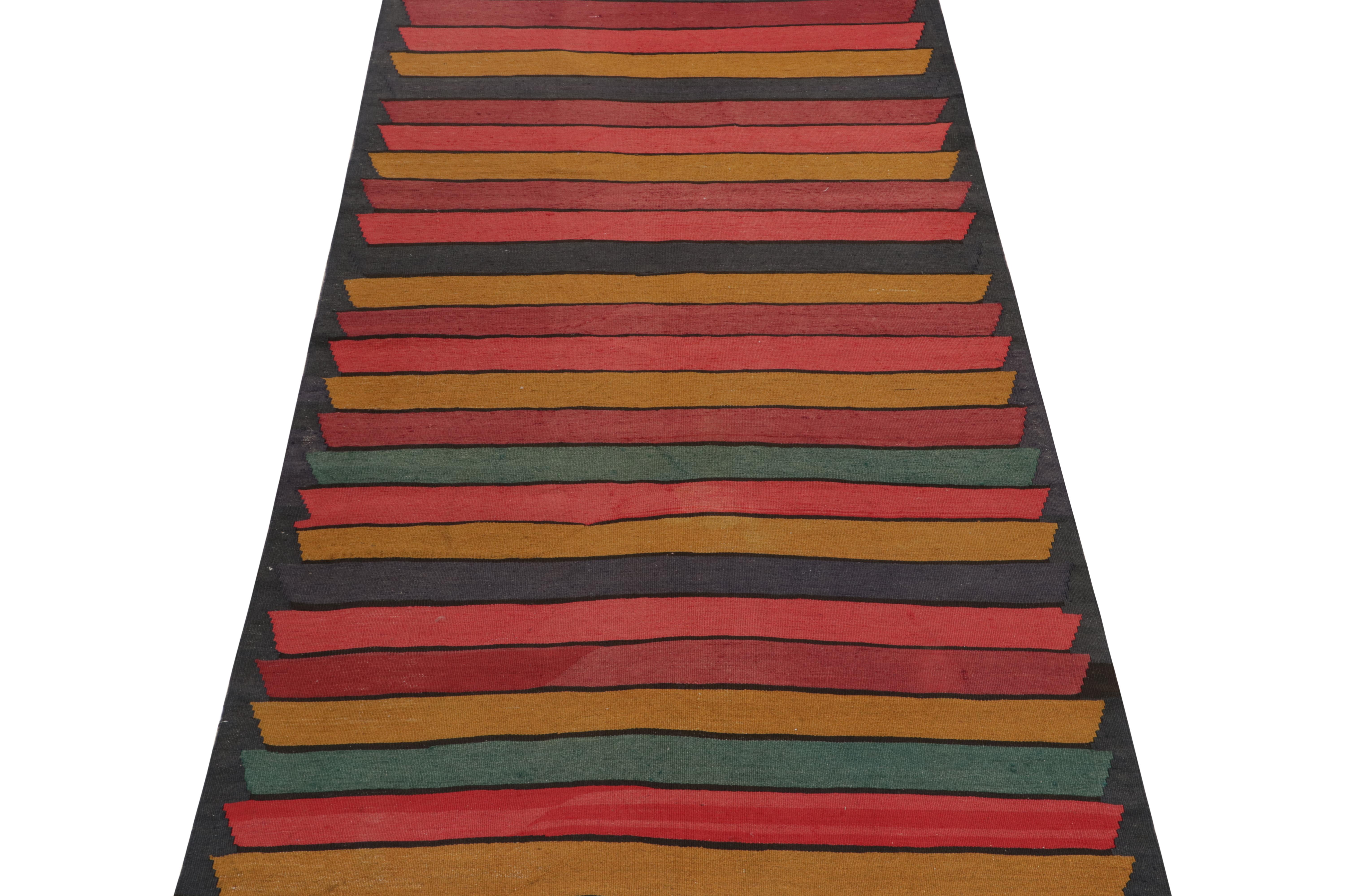 This vintage 5x10 Persian Kilim is a tribal rug from Meshkin—a small northwestern village known for its fabulous works. Handwoven in wool, it originates circa 1950-1960.

Further on the Design:

The bold design prefers polychromatic stripes and a