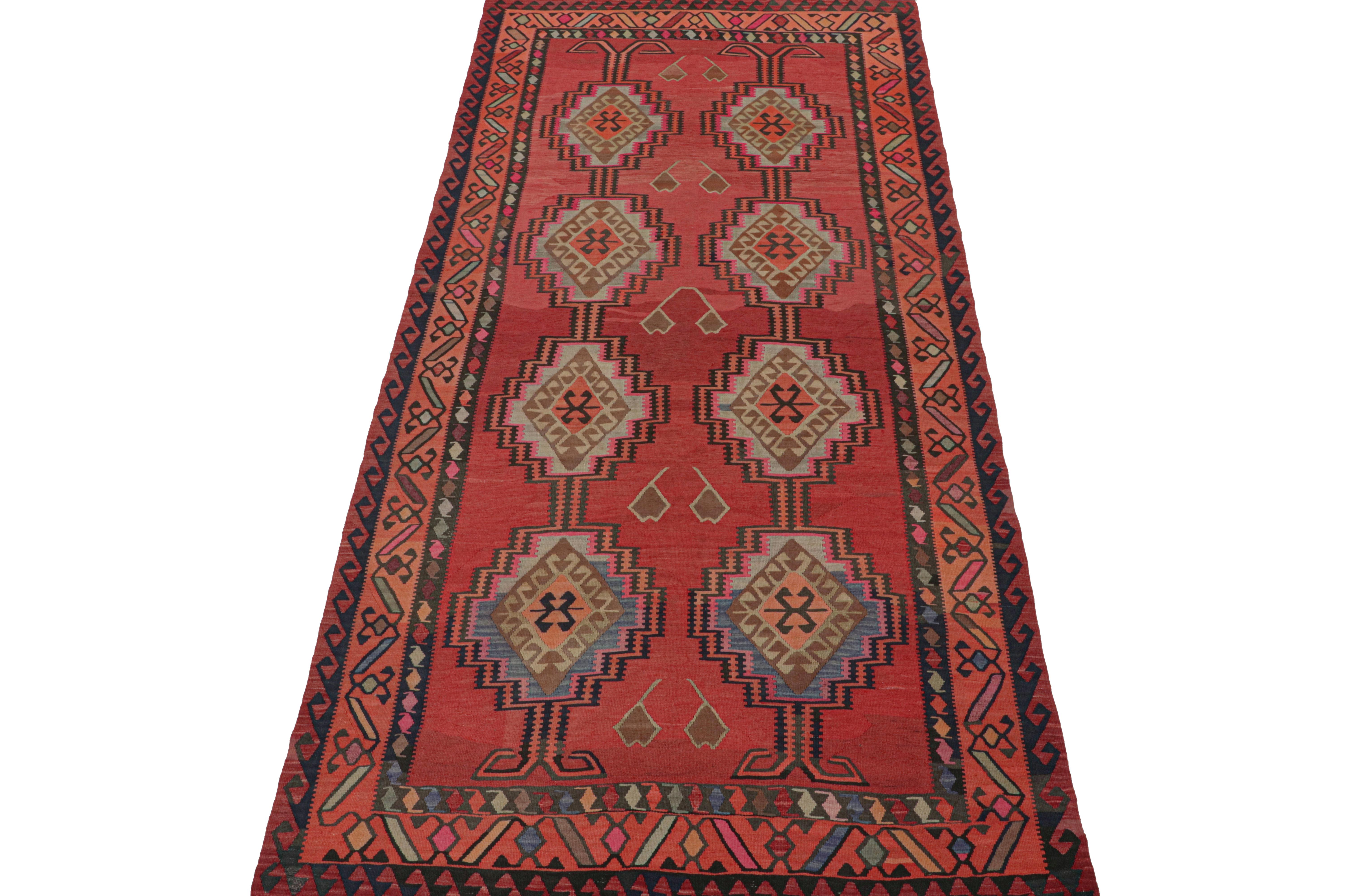 This vintage 6x13 Persian Kilim is believed to be a tribal rug from Meshkin—a small northwestern village known for its fabulous works. Handwoven in wool, it originates circa 1950-1960. 

Its design favors medallions and other traditional geometric