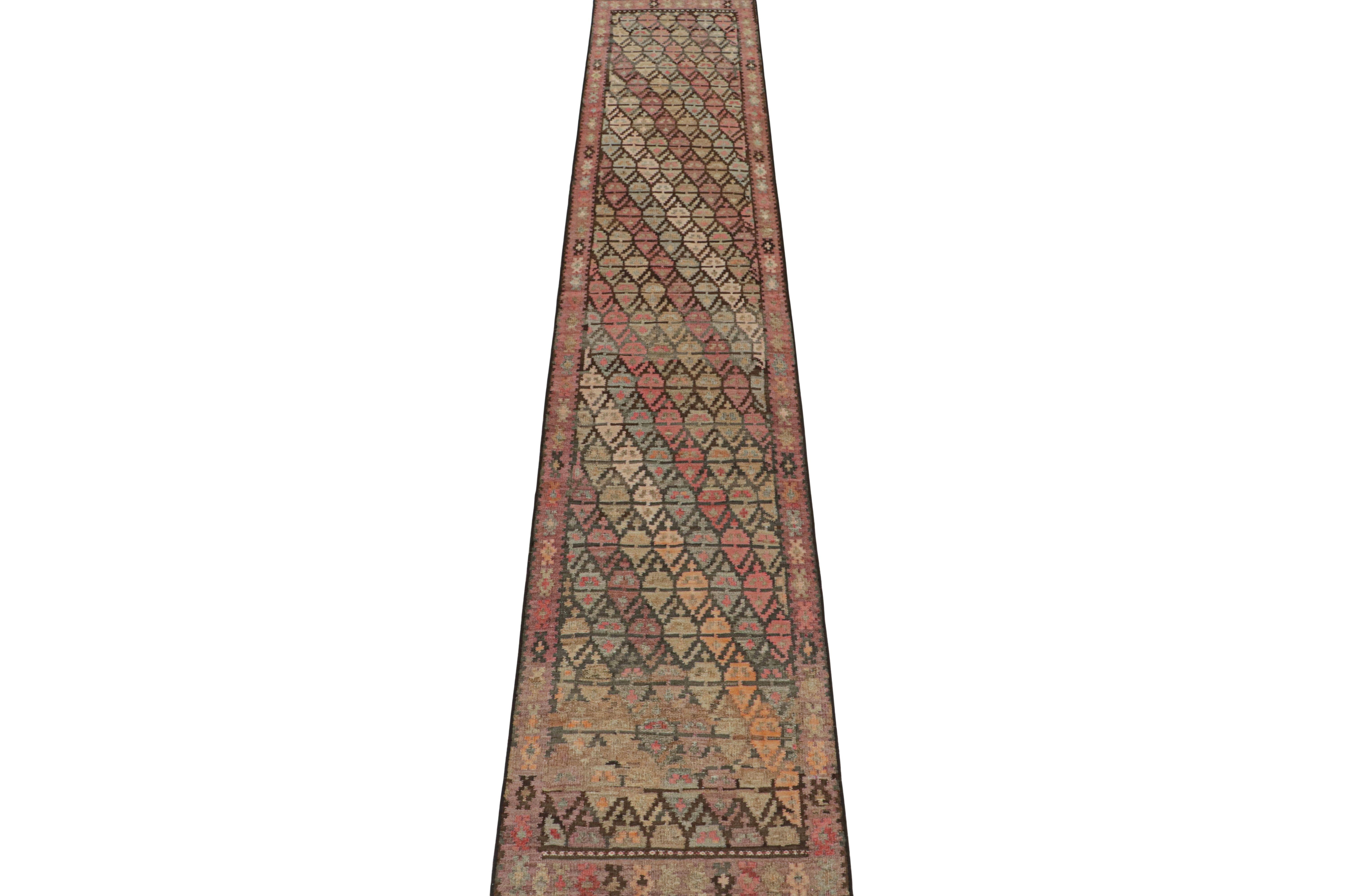 This vintage 3x15 Persian Kilim runner is handwoven in wool and originates circa 1950-1960. This Kilim is believed to hail from Meshkin—a small village known for its craft among what connoisseurs call 