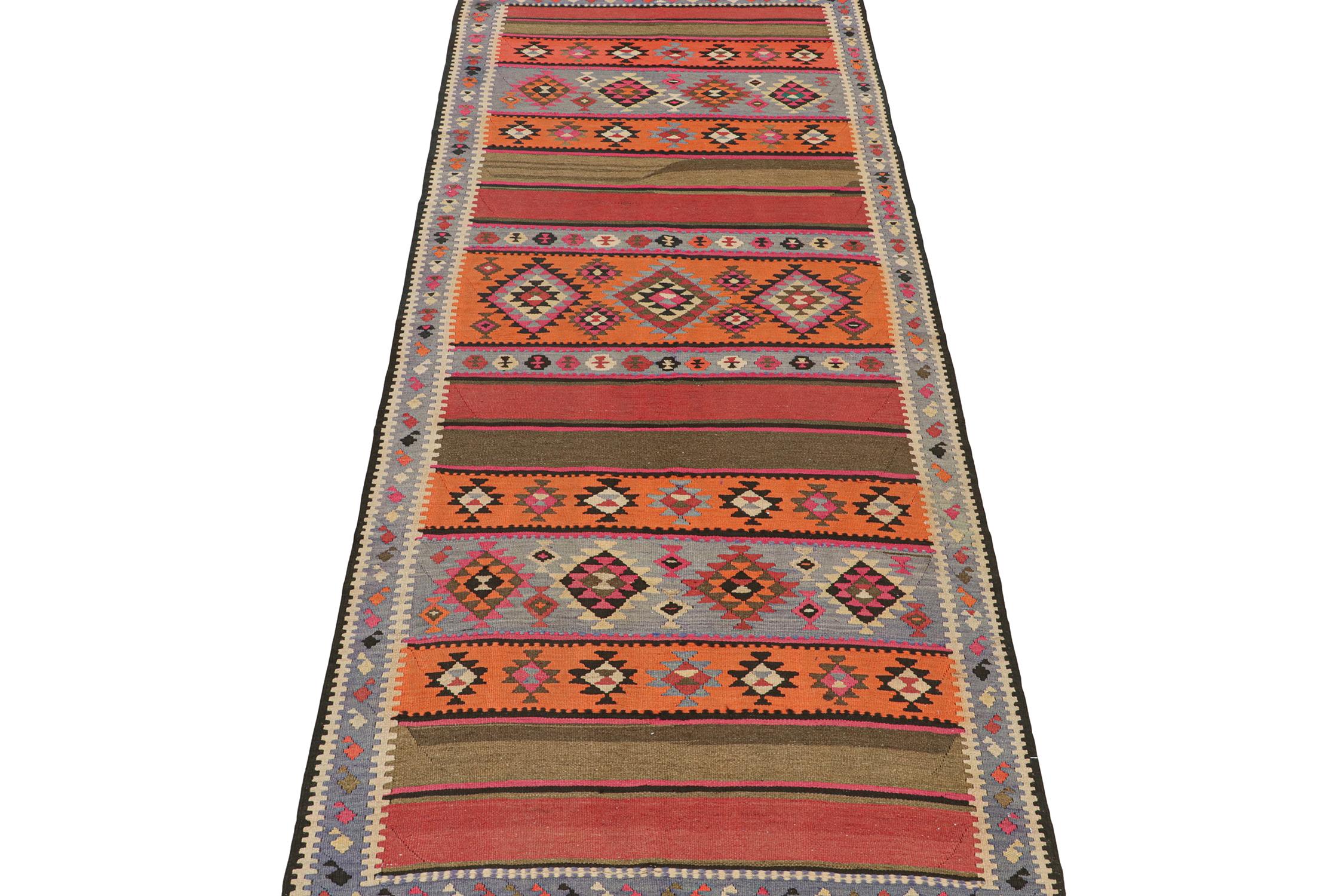 This vintage 5x13 Persian Kilim is a tribal rug we believe hails from Meshkin—an Iranian village known for its craft. Handwoven in wool, it originates circa 1950-1960.

The design favors vibrant colors in a polychromatic colorway with very