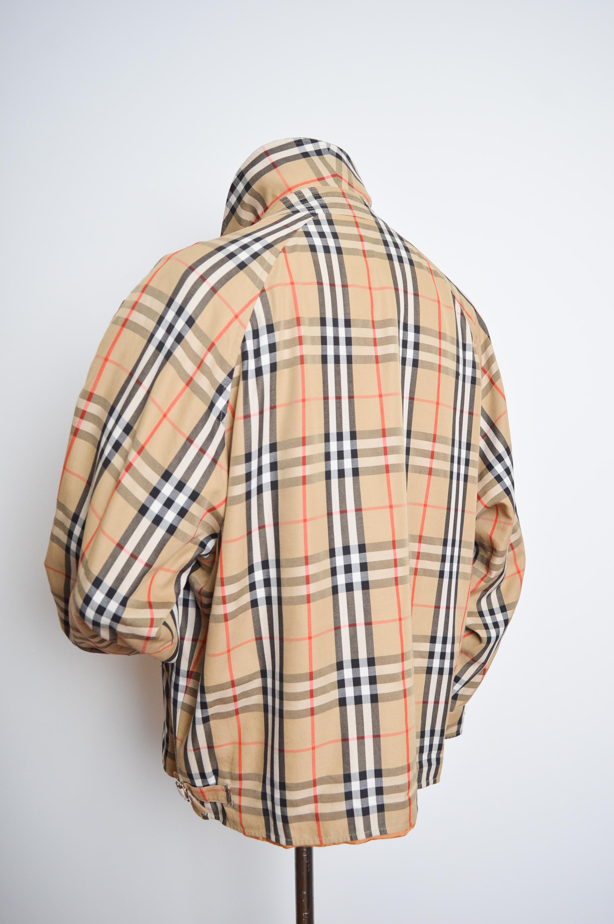 Superb Vintage BURBERRY's of London, Harrington jacket in the Iconic Nova Check.
Circa 1980. 

MADE IN ENGLAND.  

Features: Oversized loose fit, Long sleeves, central line zip fasten closure, 2 hip pockets, Caramel coloured acetate