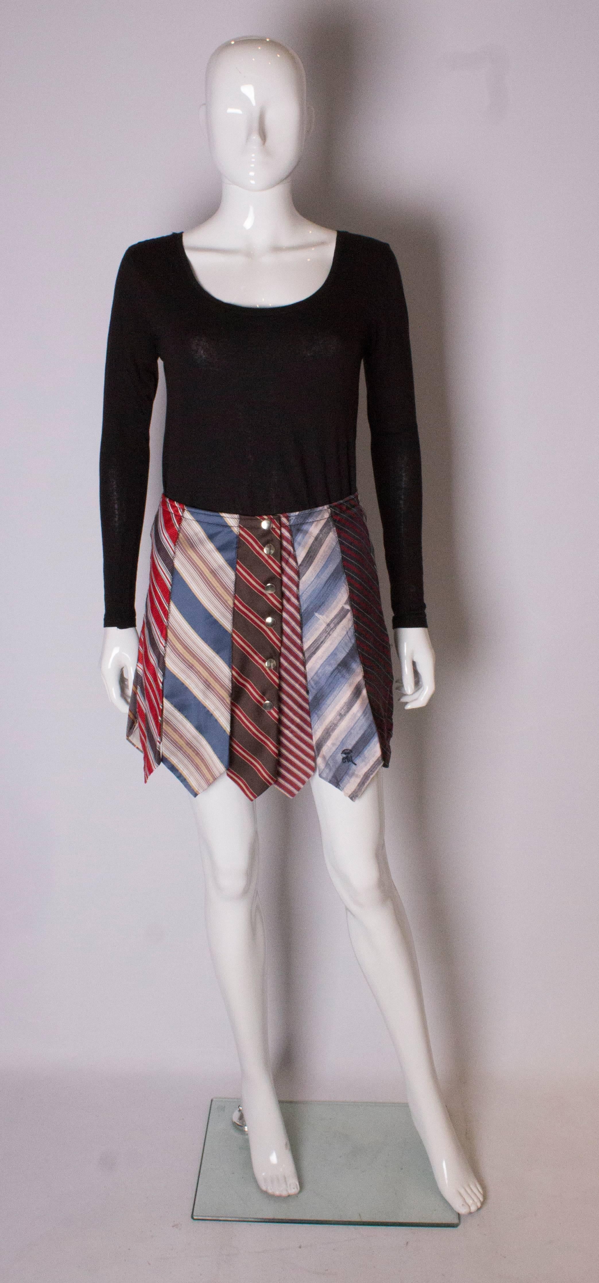 A fun skirt for summer. The skirt is made out of vintage silk  ties of varying colours.  The skirt is A line, and  has a popper fastening at the front.