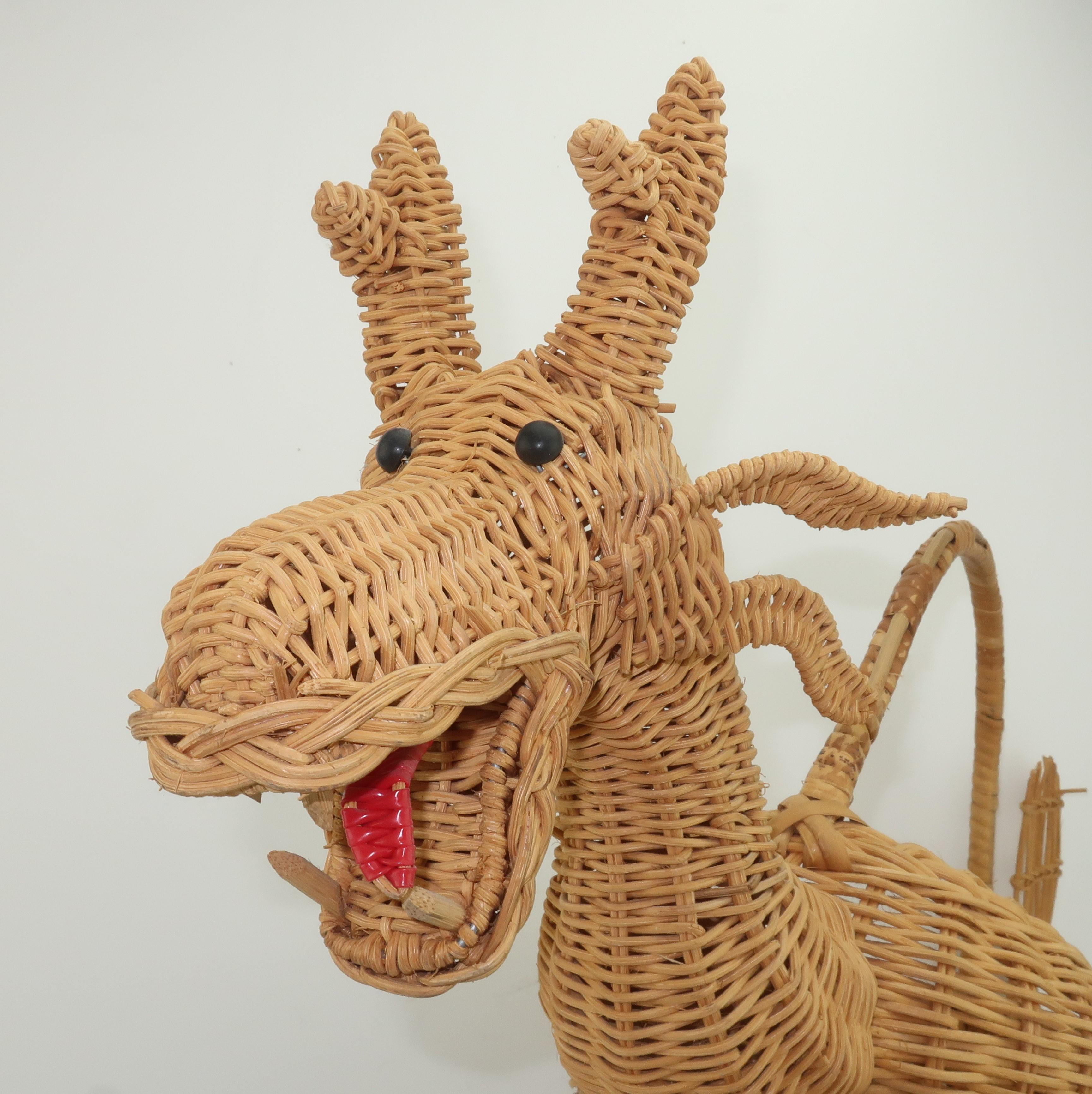 A wonderfully whimsical vintage wicker dragon basket. The natural wicker color is enhanced by the dragon’s black eyes and red tongue. His top handle provides an easy way to carry whatever you store in the generous container ... fruit, flowers,