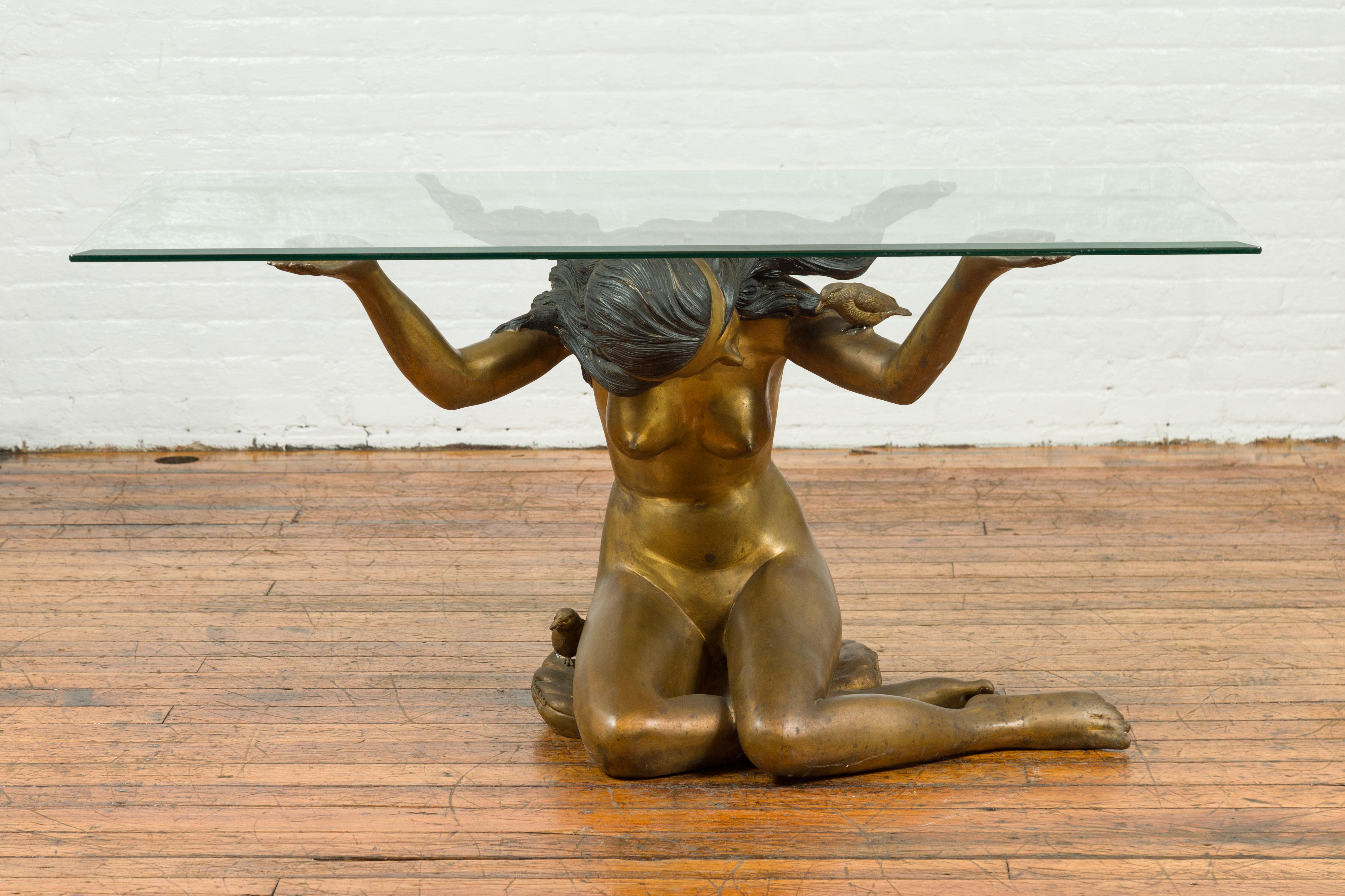 A vintage nude woman bronze table base from the mid-20th century, with gold patina. Crafted during the mid-20th century, this vintage bronze table base captivates with its elegant depiction of a nude woman. Skillfully created using the traditional