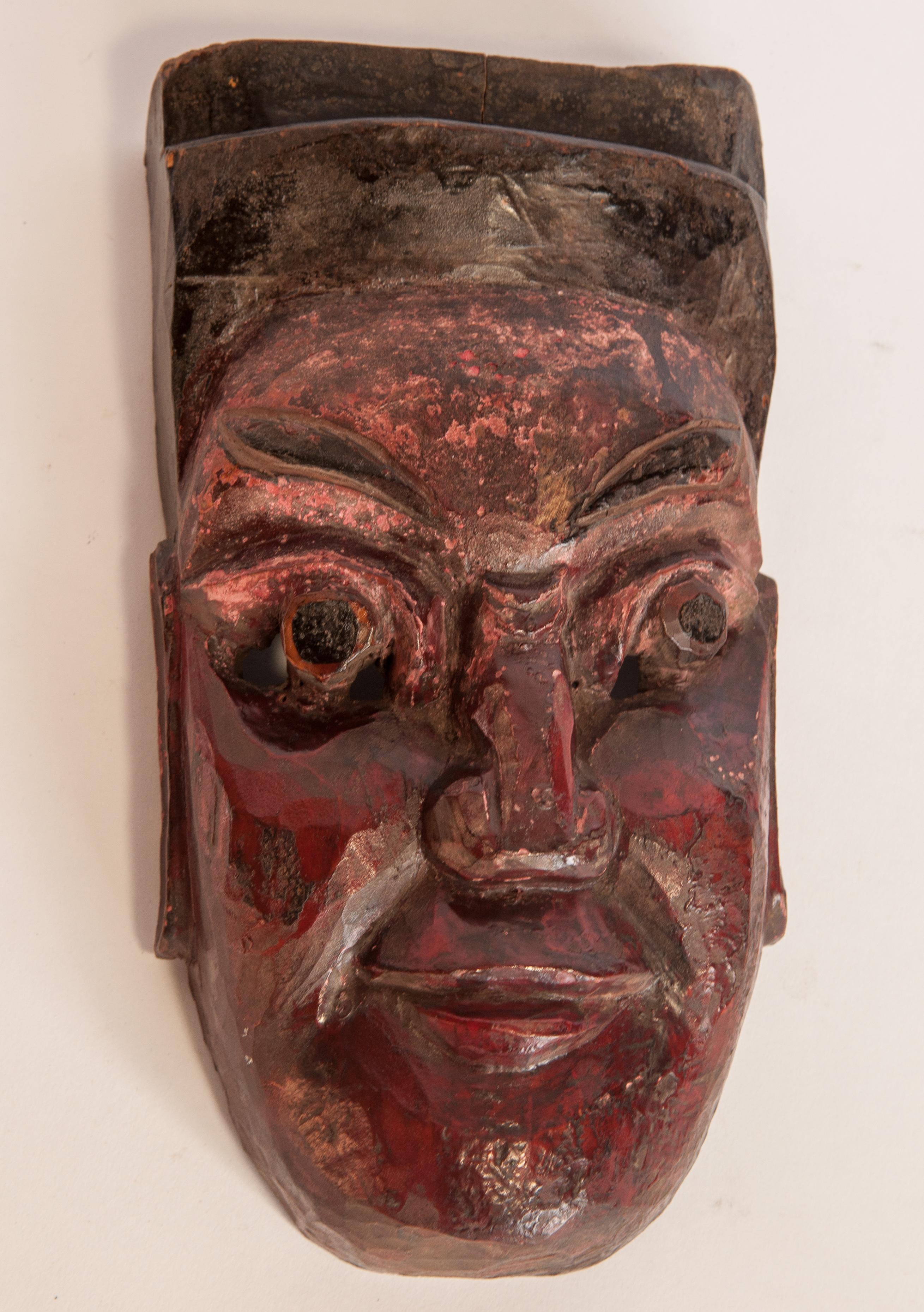 Vintage Nuo theater or ceremonial performance mask from Guizhou, South China, mid-20th century.
Nuo refers literally to a kind of exorcism, or driving out of spirits. Nuo theater and dance dramas were performed on the fourth day of the annual Nuo