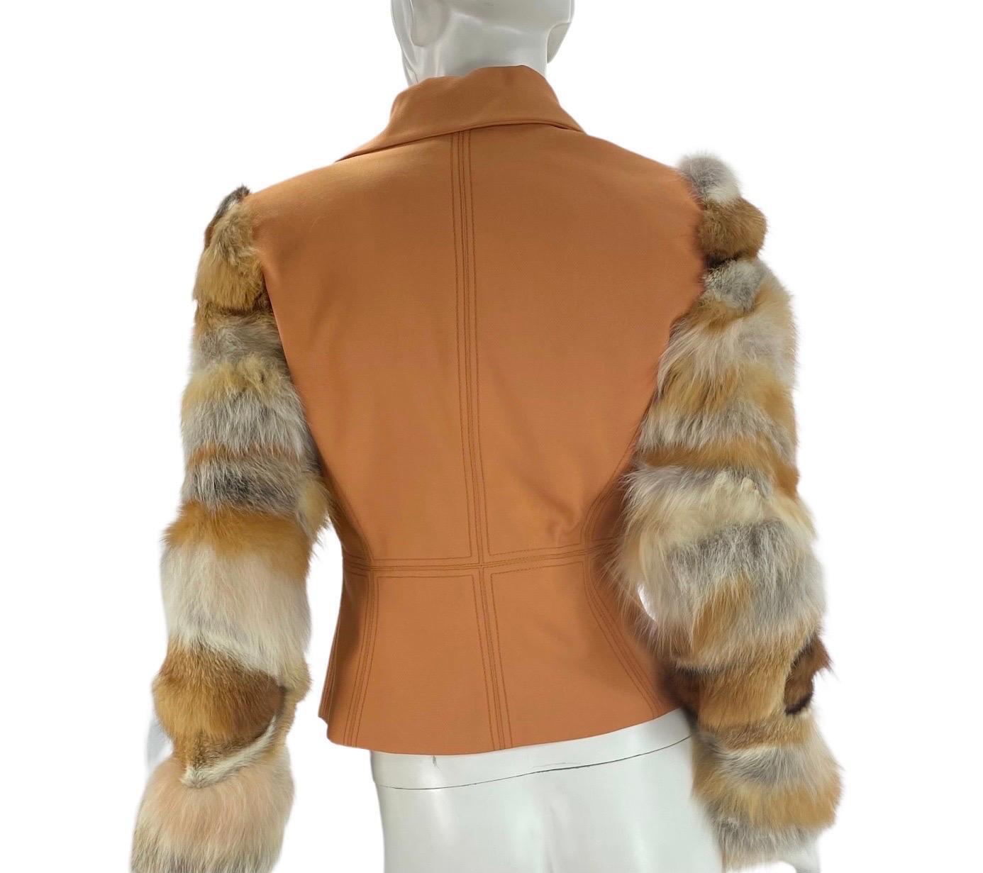 Vintage Gianni Versace Couture Orange Wool Fox Fitted Jacket
Italian size 42
Jacket with V-neck featuring pointed collar, fox fur sleeves and exposed zip closure at front.
Composition - 61 % wool, 39 % fox. Medusa signature lining. Peplum
