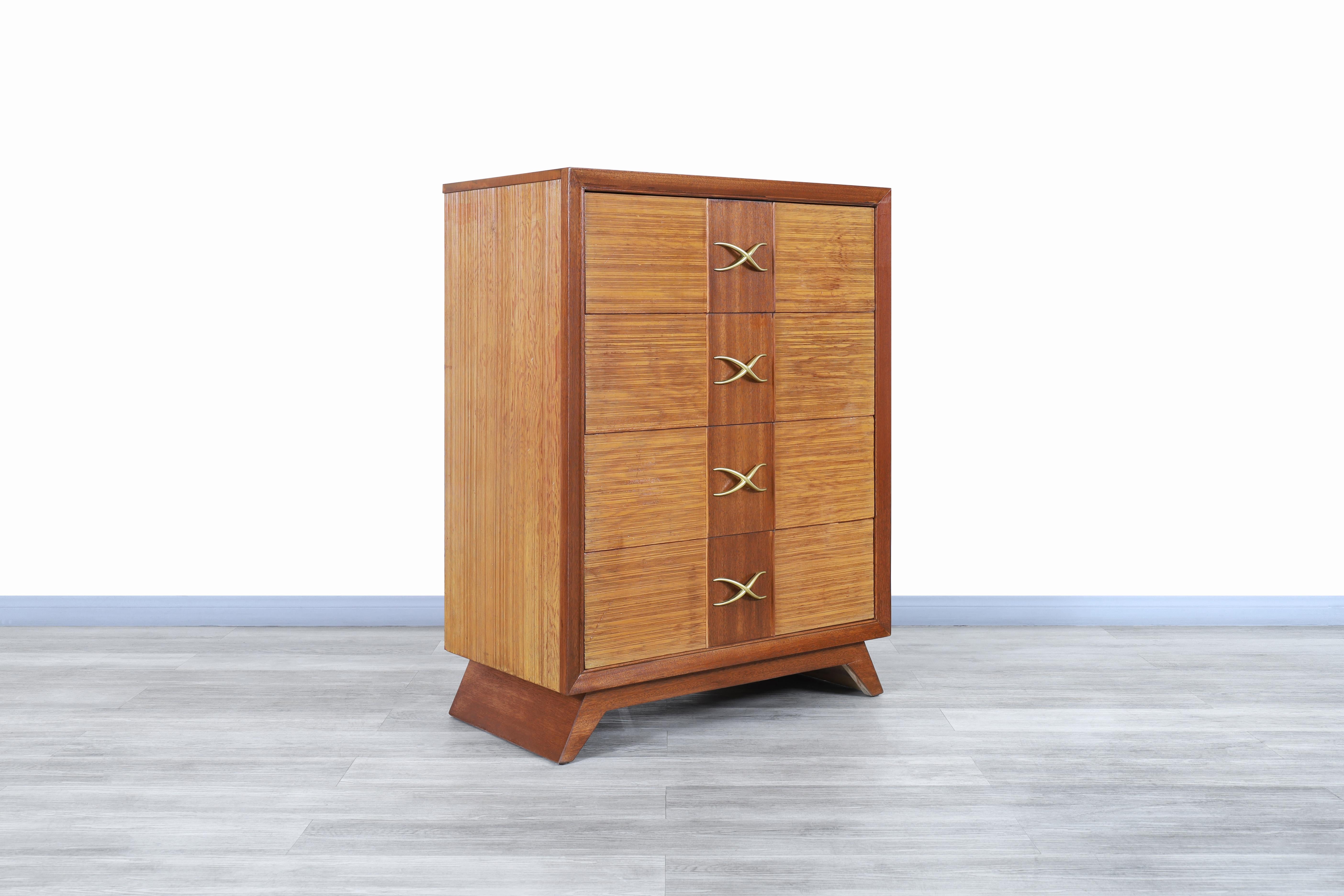 Stunning vintage oak and brass chest of drawers / tall dresser designed by Paul Frankl for Brown Saltman, circa 1950s. This beautiful chest of drawer’s features a Minimalist but highly functional design that highlights the elegance of the oak wood