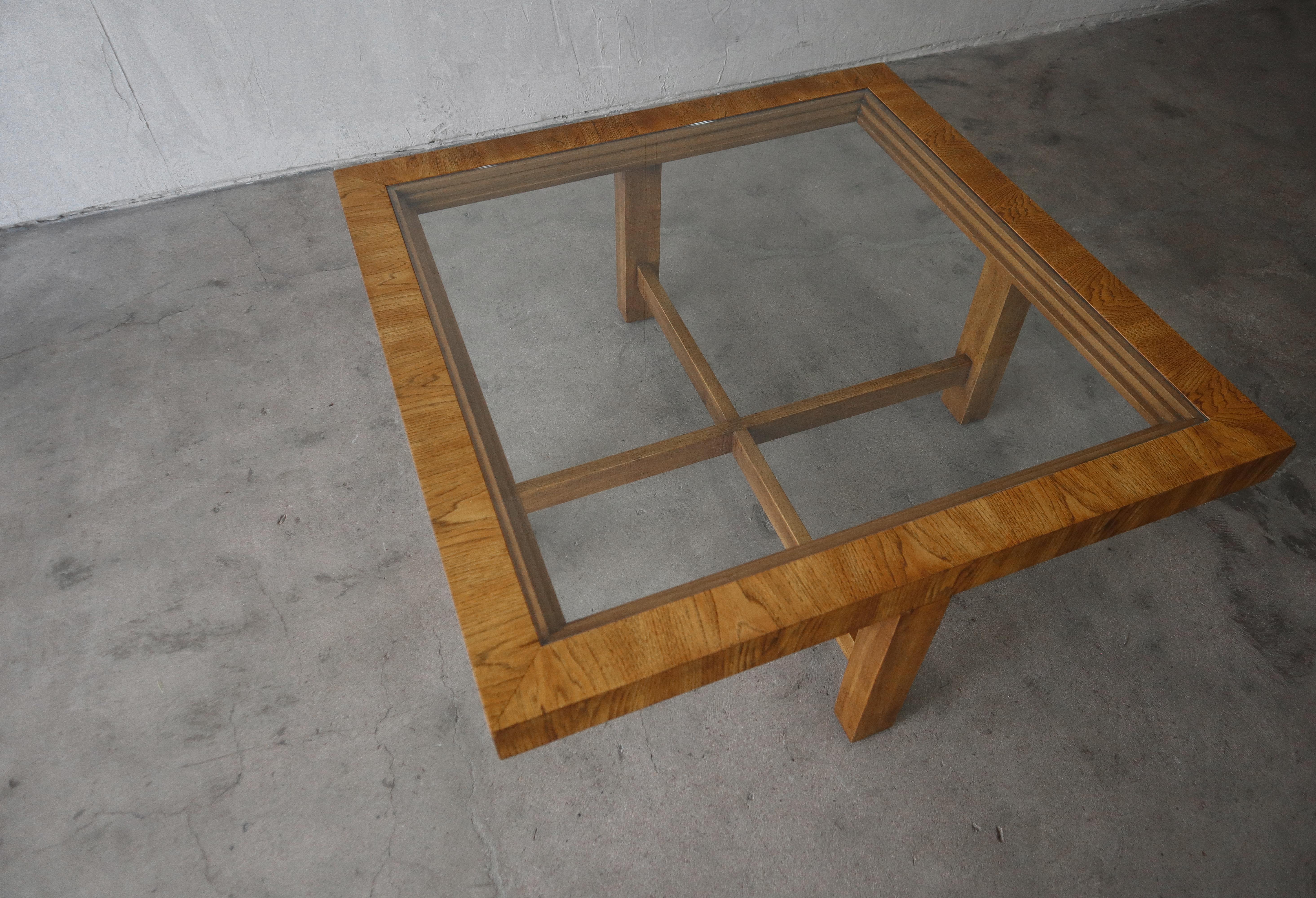 Simple and sophisticated square oak and glass coffee table. Minimal but beautiful. Gorgeous grain and wood details.

Table is in excellent vintage condition with no real damage to be noted. The glass is brand new.

