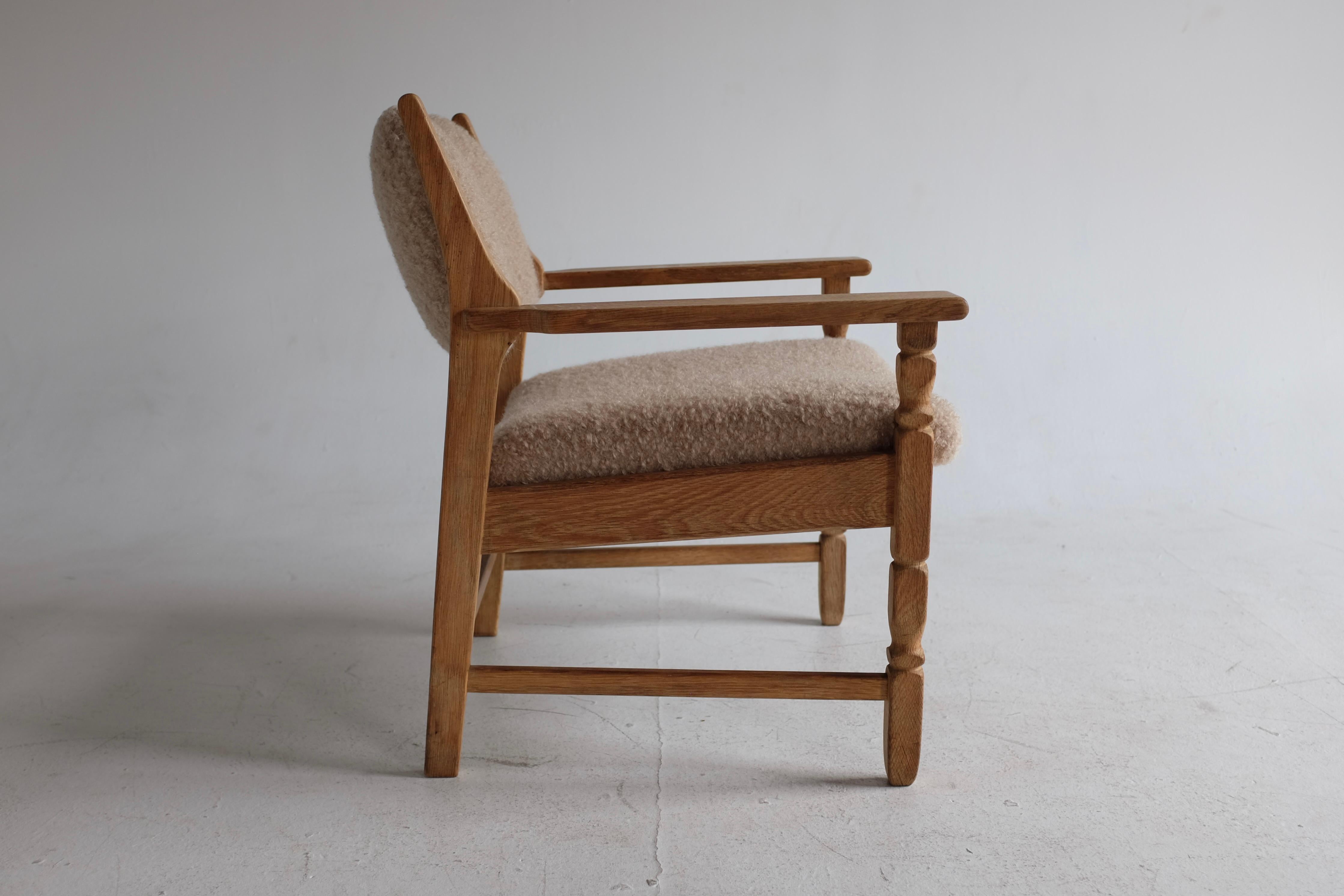 Vintage Henning Kjærnulf Oak Chair newly upholstered in Schumacher Teddy Boucle. Known for his distinctive style mixing mid-century with rustic elements the Razor Blade chair is on of Henning Kjærnulf best known designs. On this version the back is
